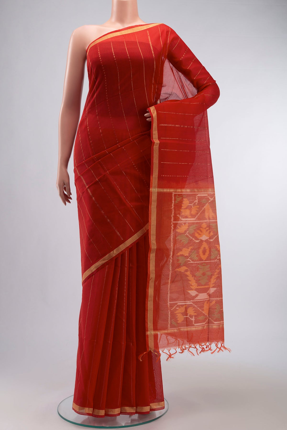 Red Silk Cotton Saree with Stripes on the body and Zari Border displayed on a mannequin