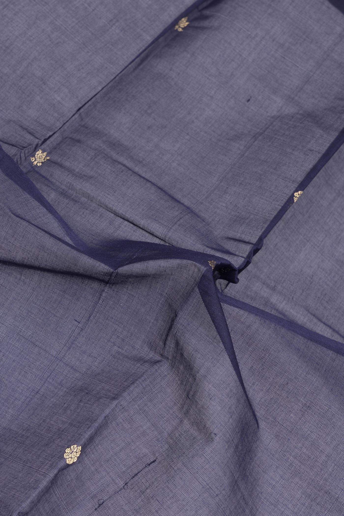 Close up of Navy Blue Kanchi Cotton Saree with Thread Butta on the body and Plain Border.  displaying folds