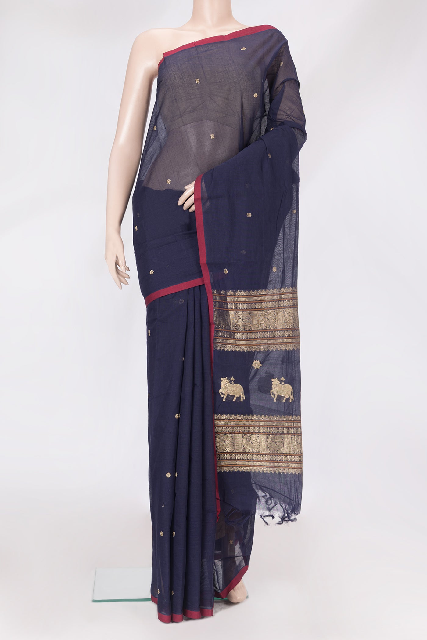 Navy Blue Kanchi Cotton Saree with Thread Butta on the body and Plain Border.  displayed on a mannequin
