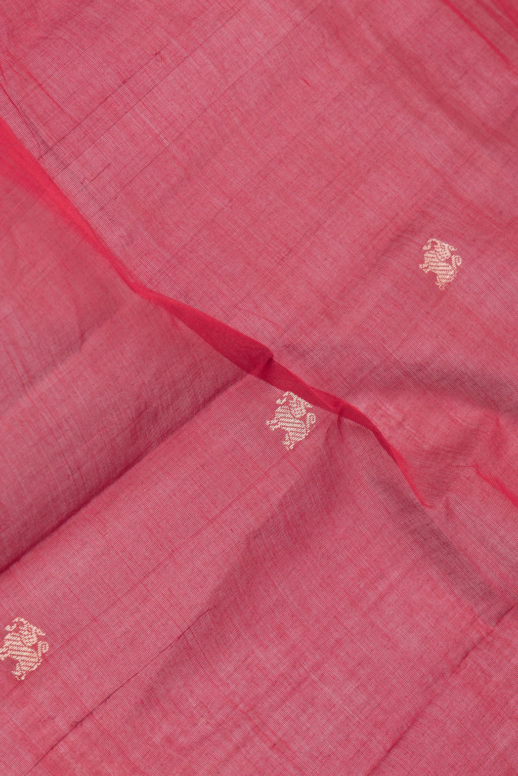Close up of Maroon Kanchi Cotton Saree with Thread Butta on the body and Thread Border.  displaying folds