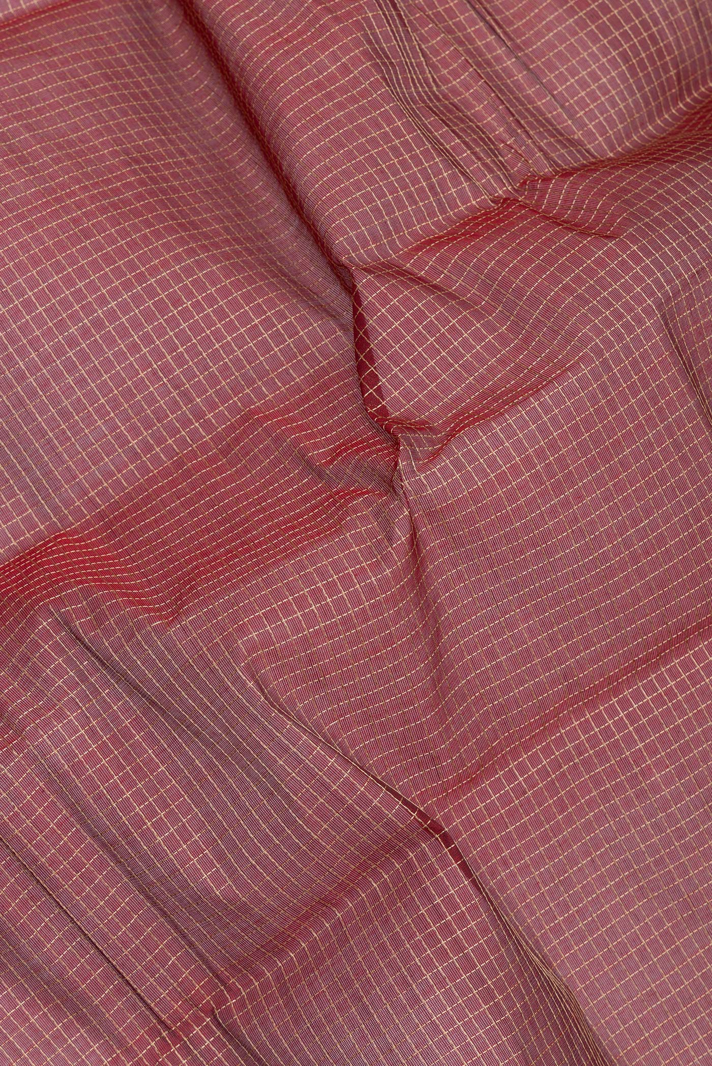 Close up of Maroon Kanchi Cotton Saree with Checked design on the body and Thread Border.  displaying folds