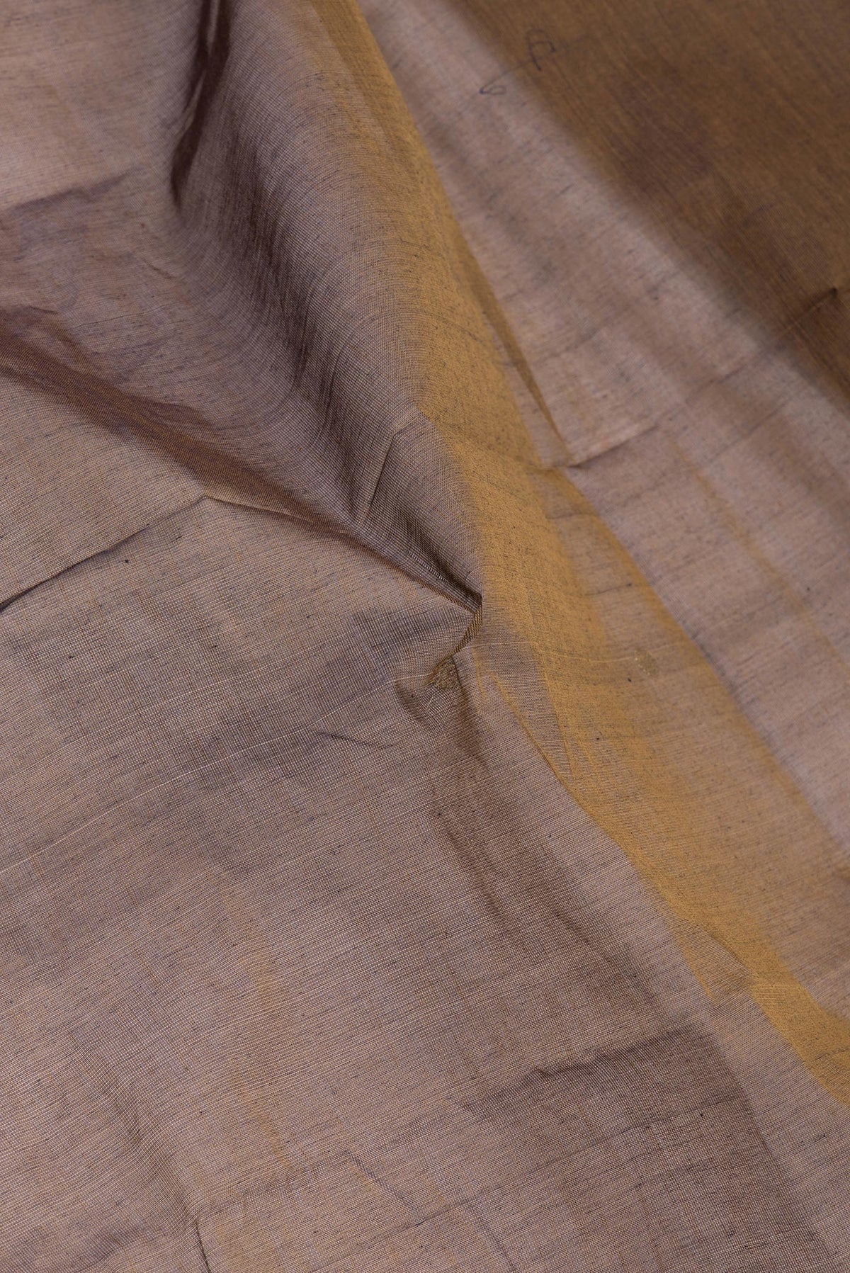 Close up of Mehandi Green Dual Tone Kanchi Cotton Saree with Zari Butta on the body and Zari And Thread Border.  displaying folds