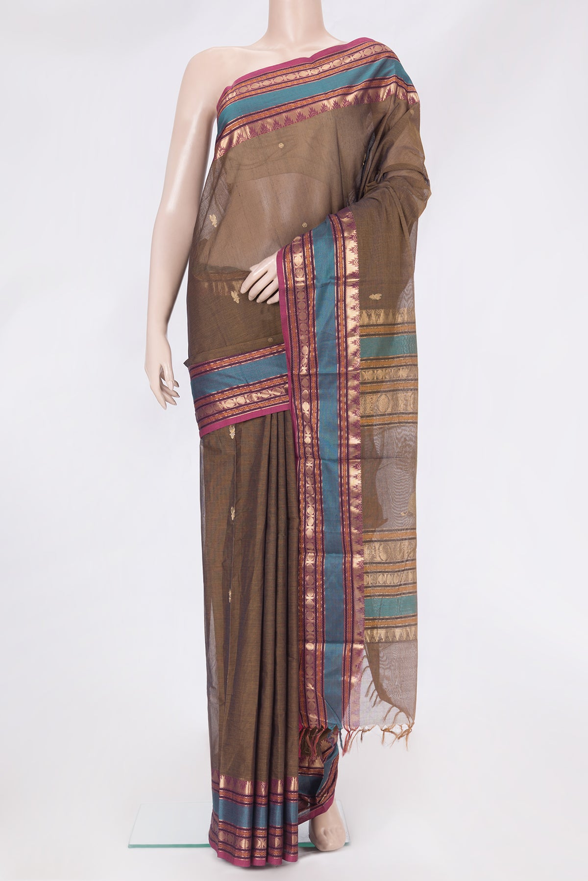 Mehandi Green Dual Tone Kanchi Cotton Saree with Zari Butta on the body and Zari And Thread Border.  displayed on a mannequin