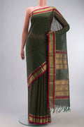 Green Kanchi Cotton Saree with Thread Butta on the body and Zari And Thread Border displayed on a mannequin