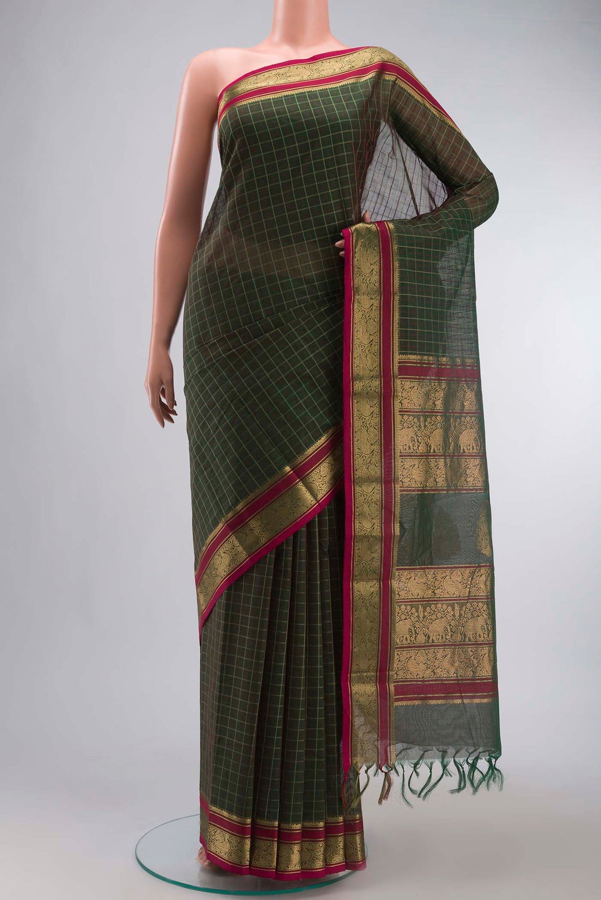 Green Kanchi Cotton Saree with Thread Butta on the body and Zari And Thread Border displayed on a mannequin