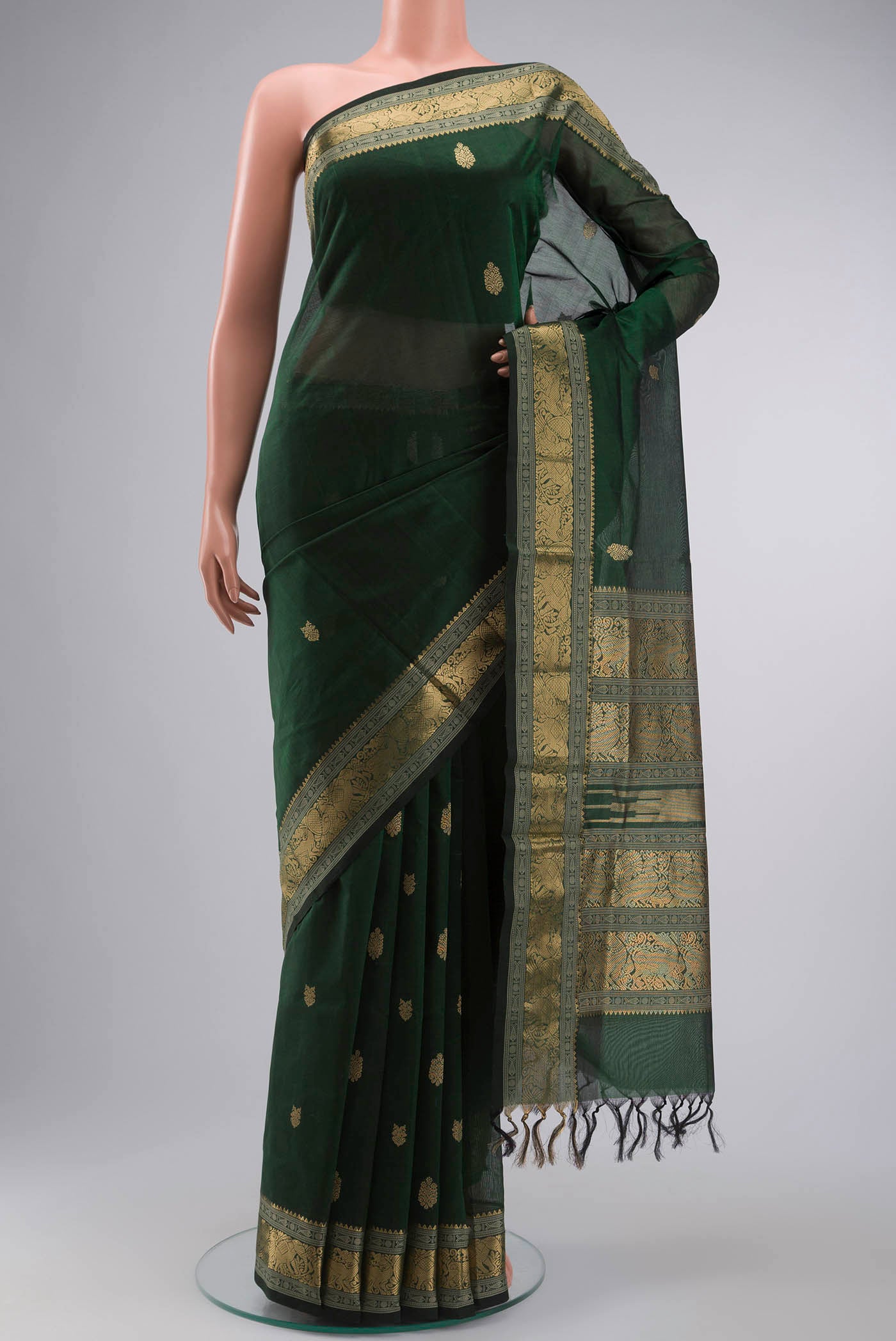 Green Silk Cotton Saree with Zari Butta on the body and Zari Border displayed on a mannequin