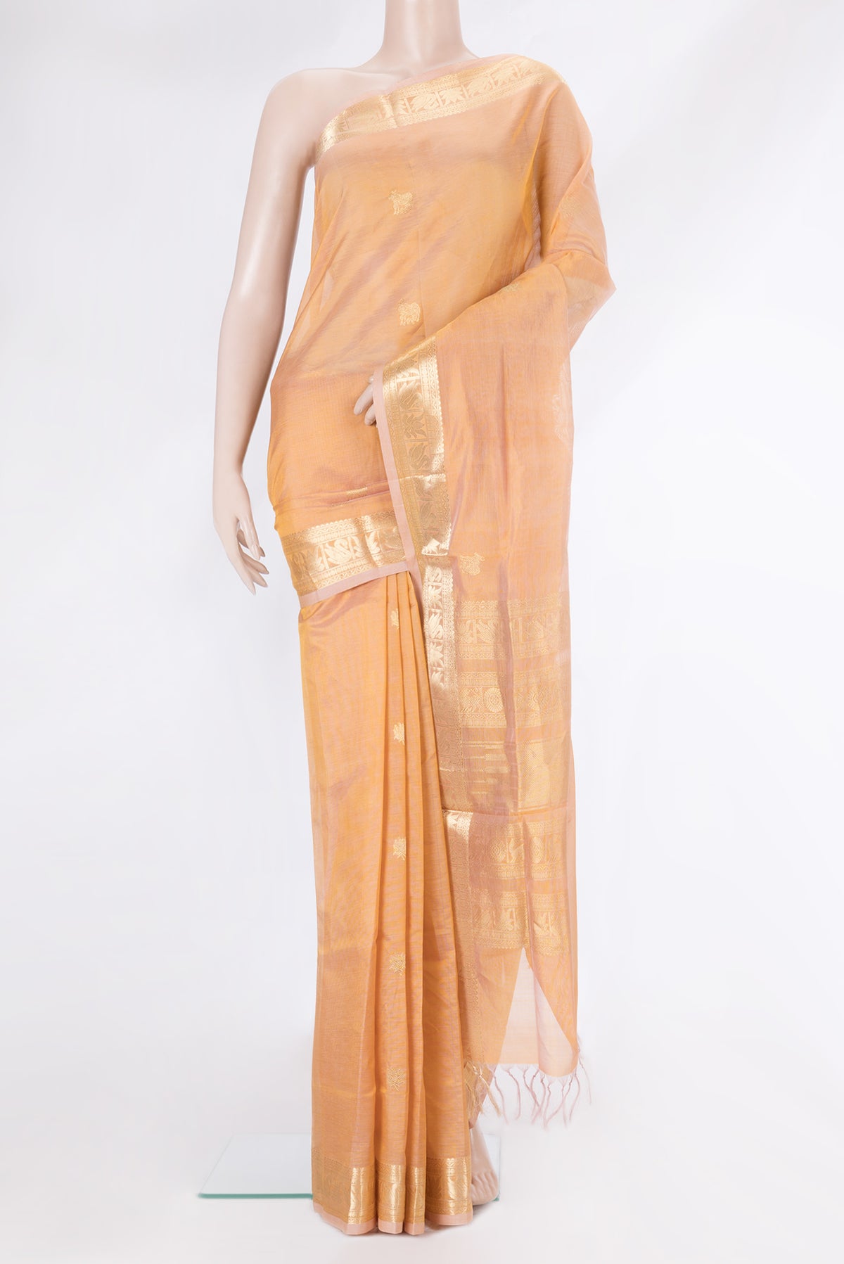 Sandal Silk Cotton Saree with Zari Butta on the body and Zari Border.  displayed on a mannequin
