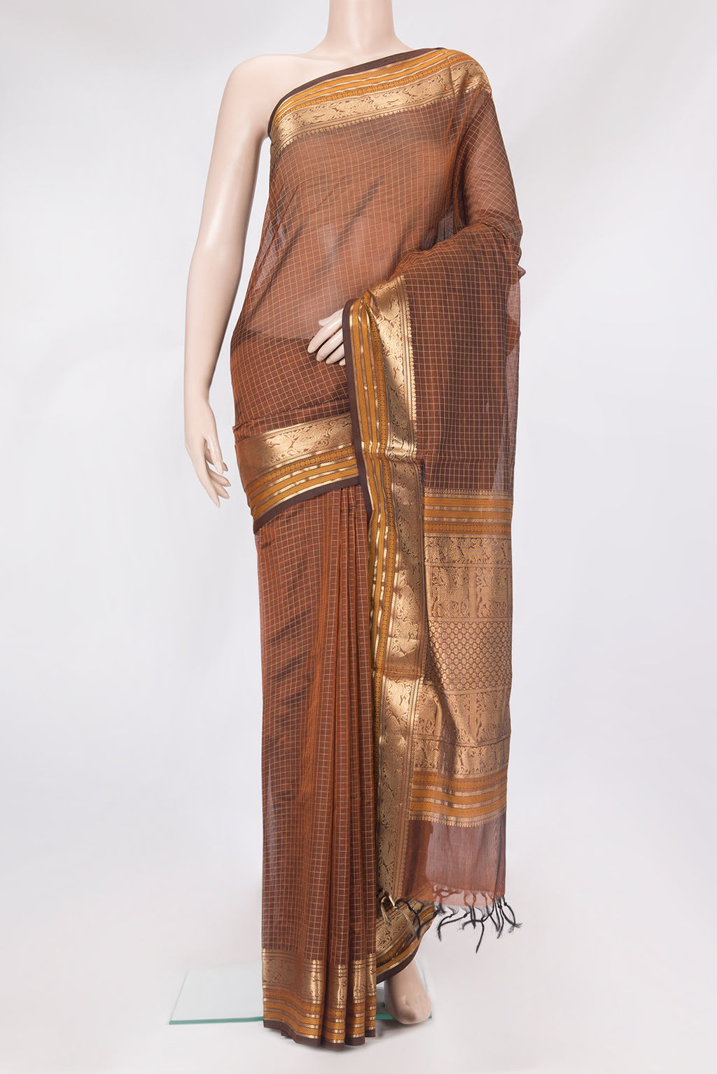 Brown Silk Cotton Saree with Checked design on the body and Zari Border.  displayed on a mannequin