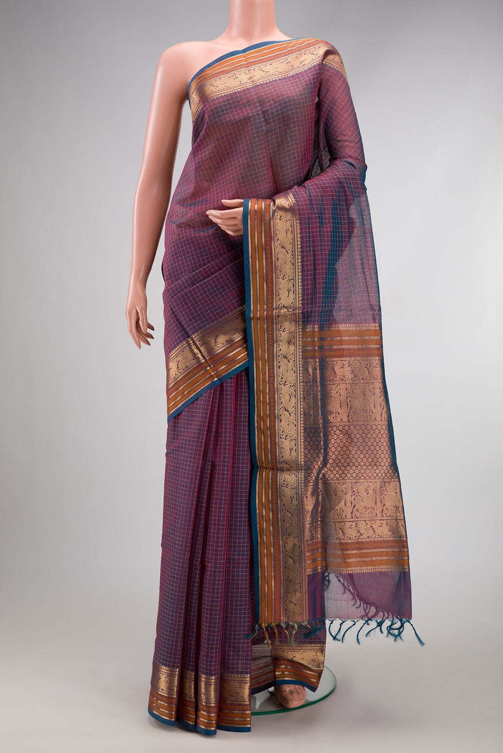 Peacock Blue Dual Tone Silk Cotton Saree with Checked design on the body and Zari Border.  displayed on a mannequin