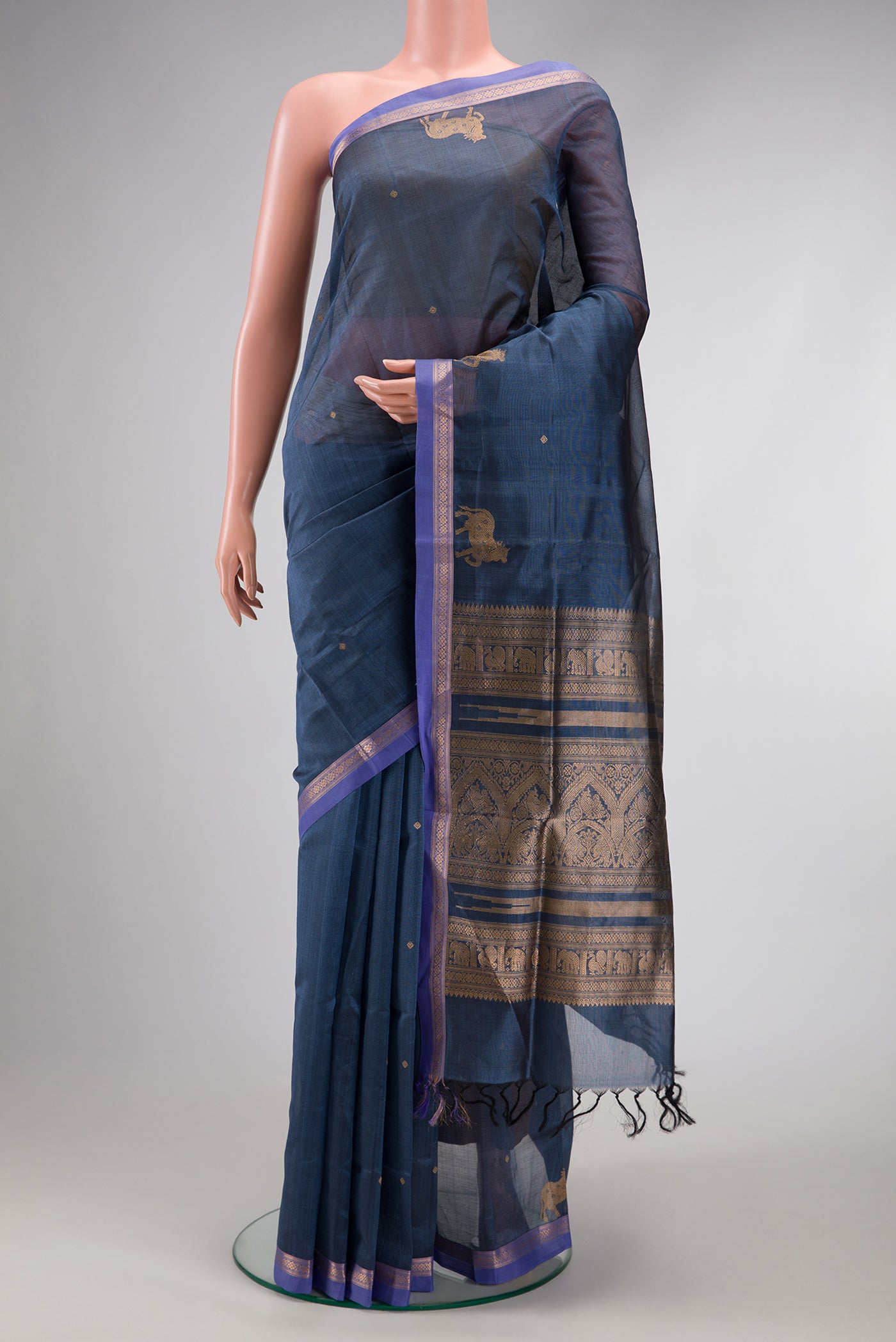 Blue Grey Dual Tone Silk Cotton Saree with Zari Butta on the body and Fancy Border.  displayed on a mannequin
