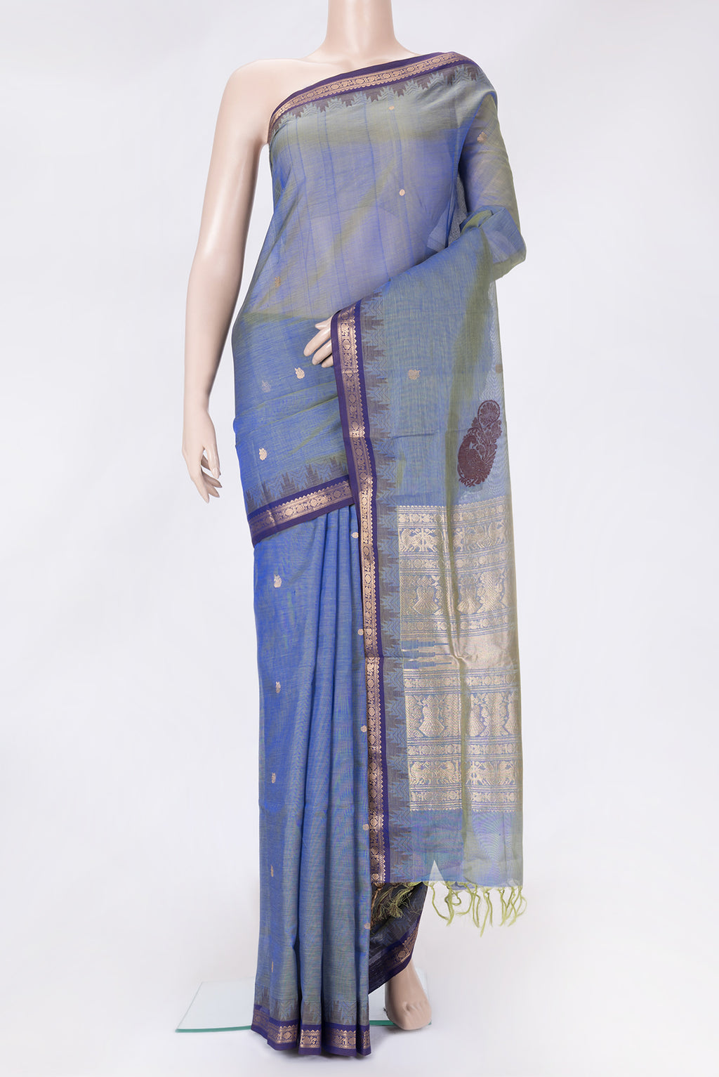 Peacock Blue Dual Tone Silk Cotton Saree with Zari Butta on the body and Zari And Thread Border.  displayed on a mannequin