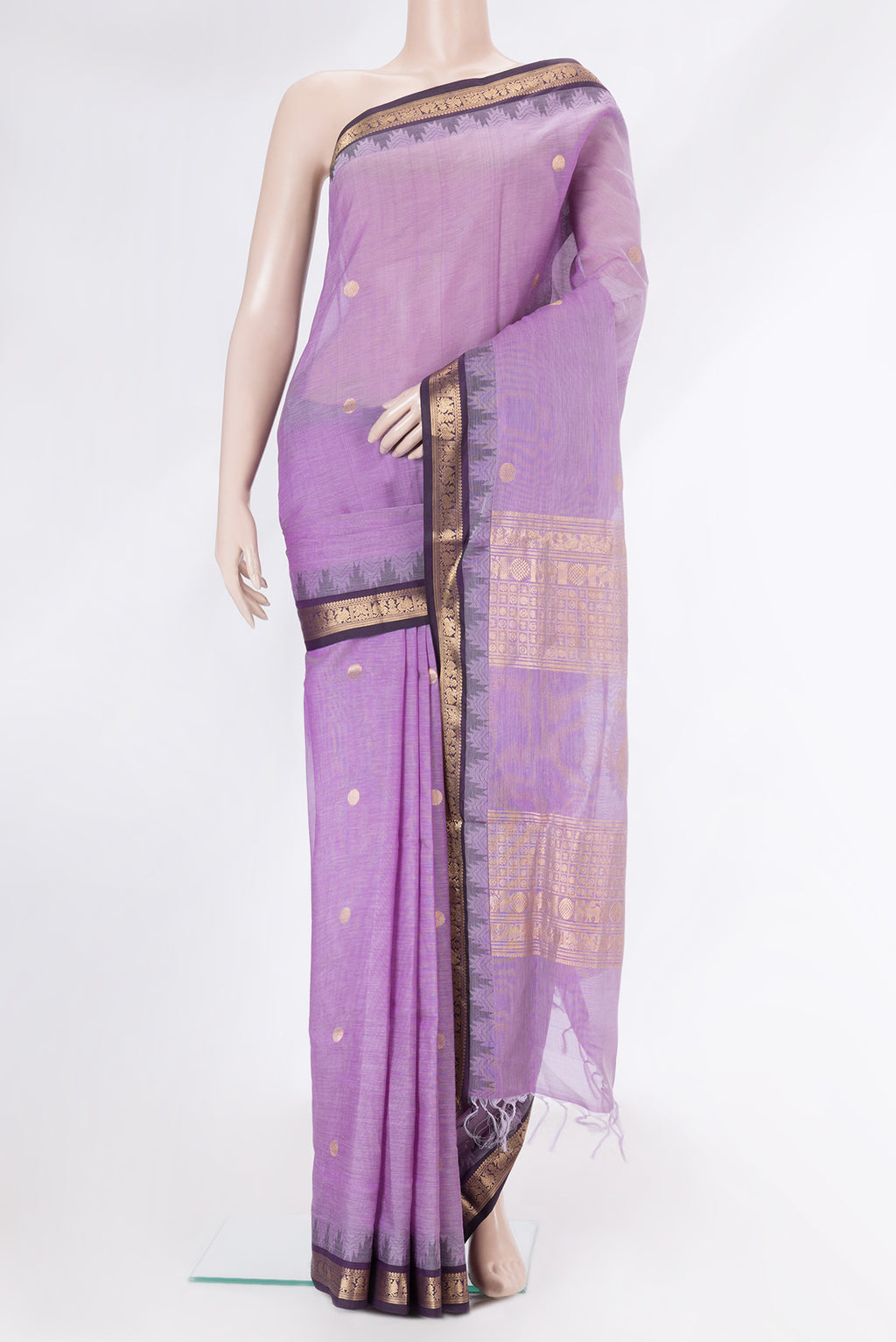Lavender Silk Cotton Saree with Zari Butta on the body and Zari Border.  displayed on a mannequin
