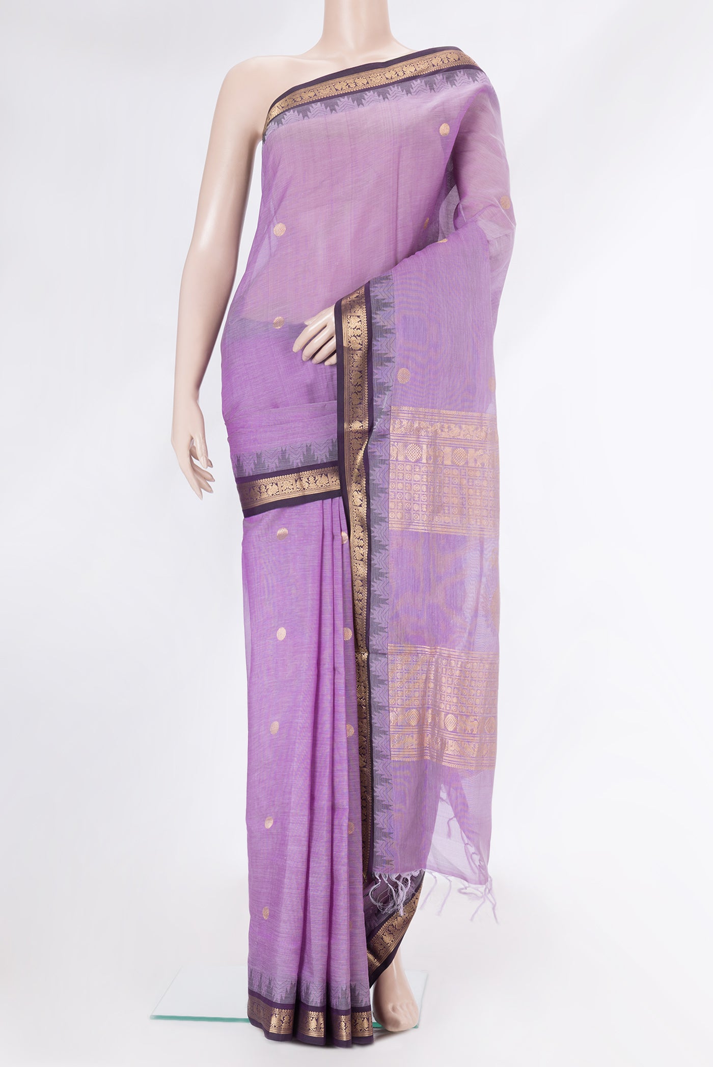 Lavender Silk Cotton Saree with Zari Butta on the body and Zari Border.  displayed on a mannequin