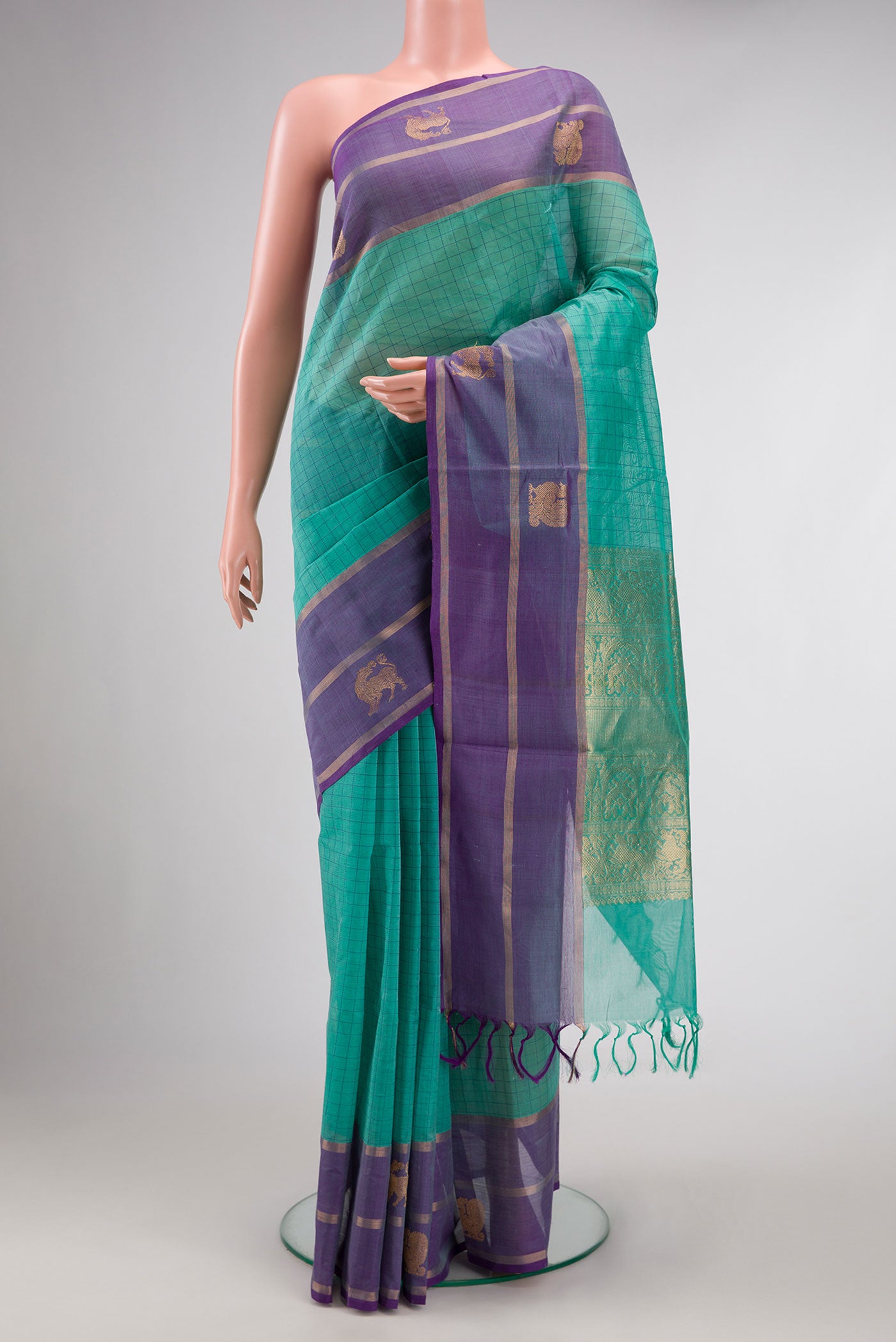 Sea Green Dual Tone Silk Cotton Saree with Checked design on the body and Fancy Border.  displayed on a mannequin
