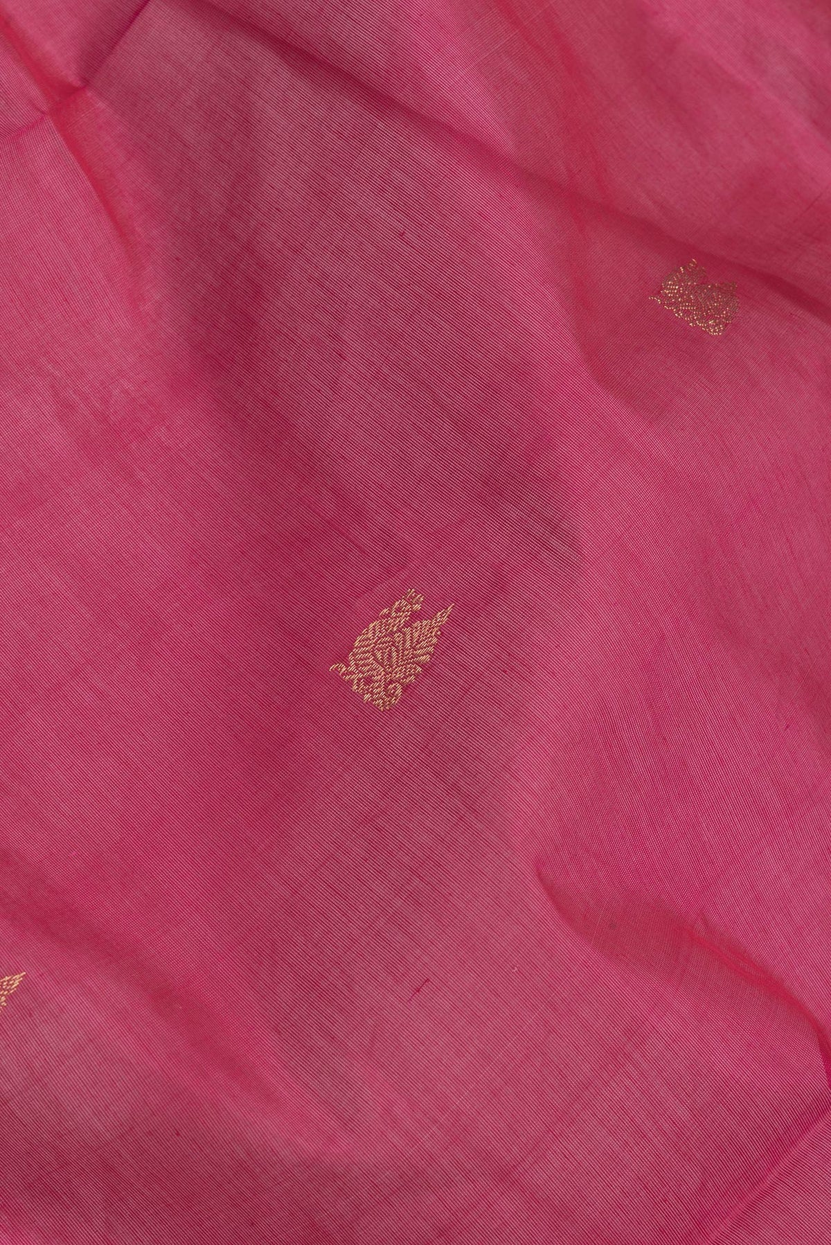 Close up of Pink Dual Tone Silk Cotton Saree with Zari Butta on the body and Zari Border.  displaying folds