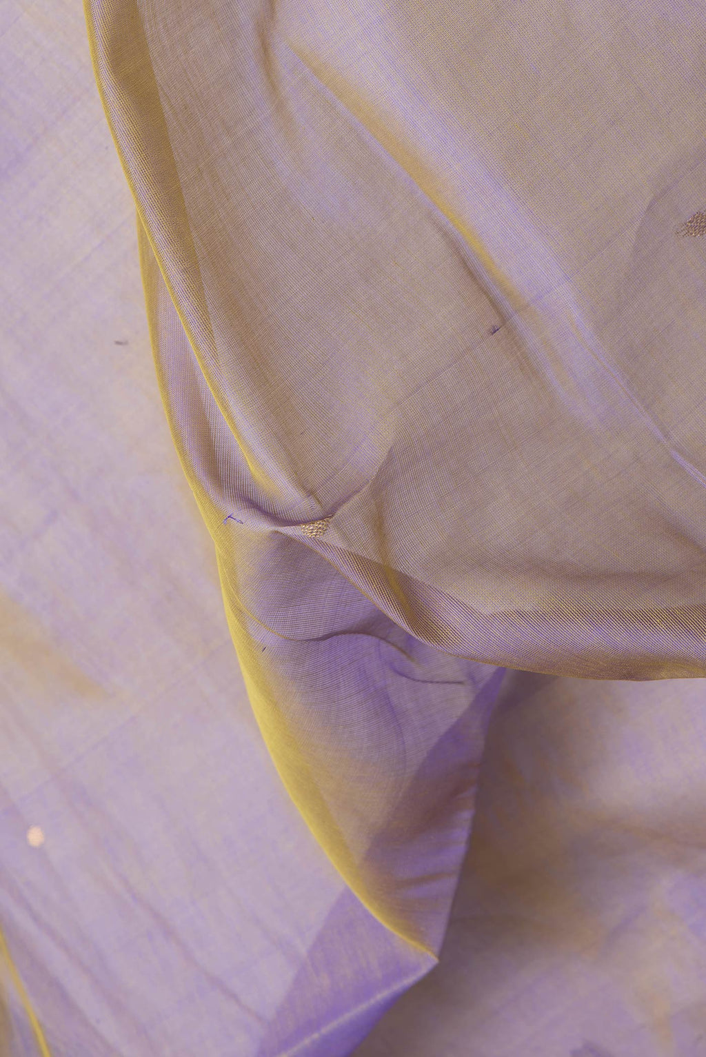 Close up of Purple Dual Tone Silk Cotton Saree with Zari Butta on the body and Zari Border.  displaying folds
