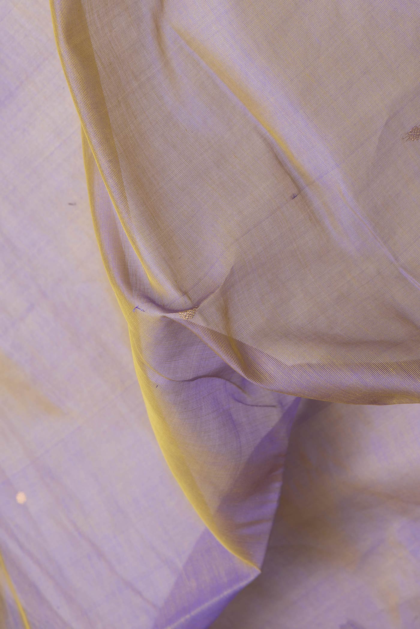 Close up of Purple Dual Tone Silk Cotton Saree with Zari Butta on the body and Zari Border.  displaying folds