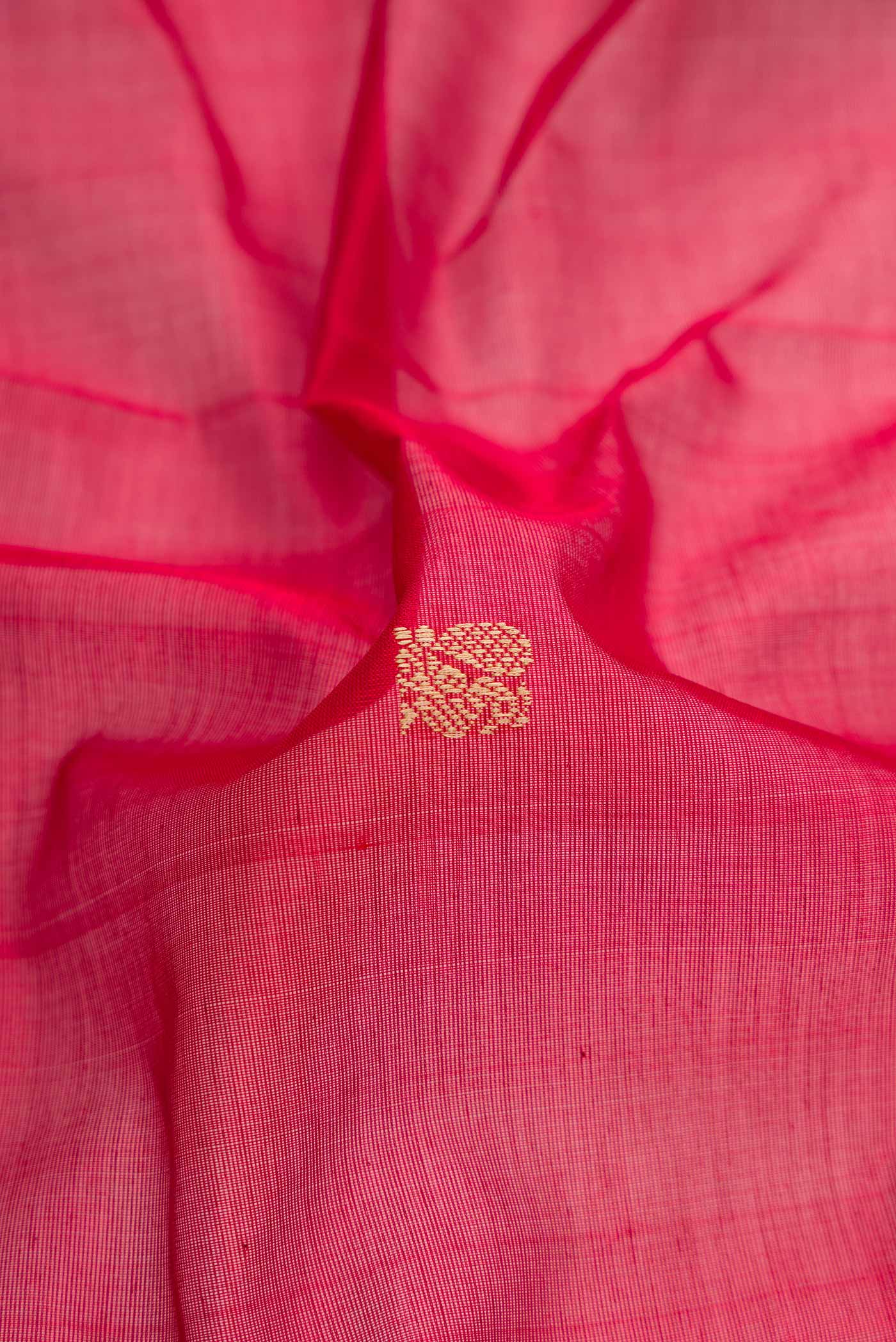 Close up of Maroon Dual Tone Silk Cotton Saree with Thread Butta on the body and Thread Border.  displaying folds