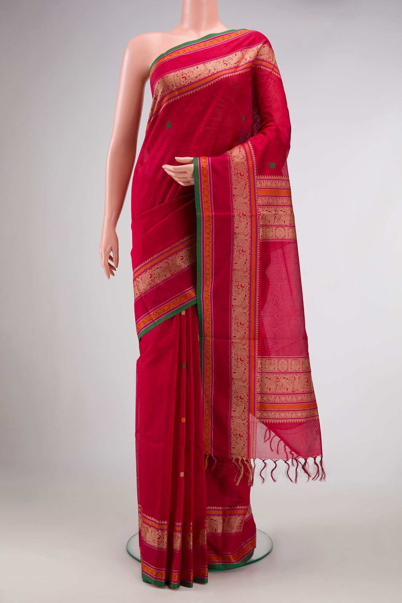 Maroon Dual Tone Silk Cotton Saree with Thread Butta on the body and Thread Border.  displayed on a mannequin