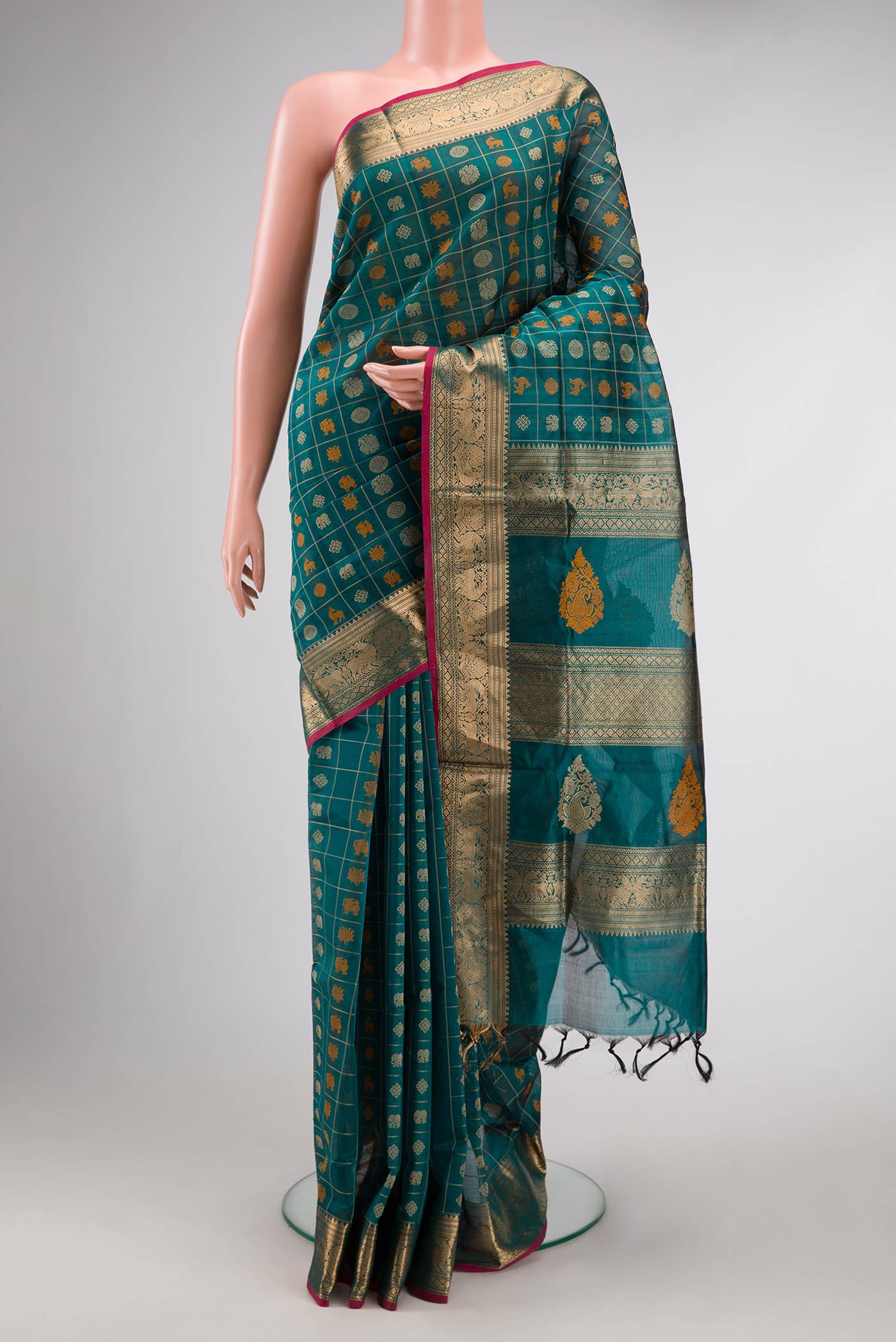 Peacock Blue Dual Tone Silk Cotton Saree with Checked design on the body and Zari Border.  displayed on a mannequin