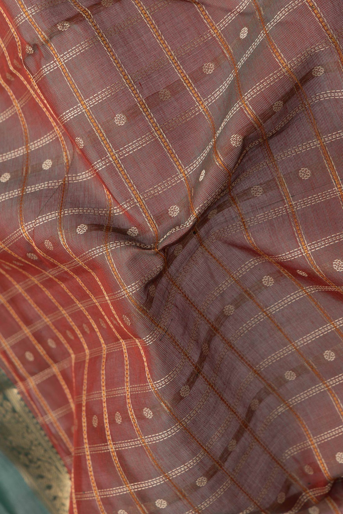 Close up of Mehandi Green Dual Tone Silk Cotton Saree with Checked design on the body and Zari Border.  displaying folds