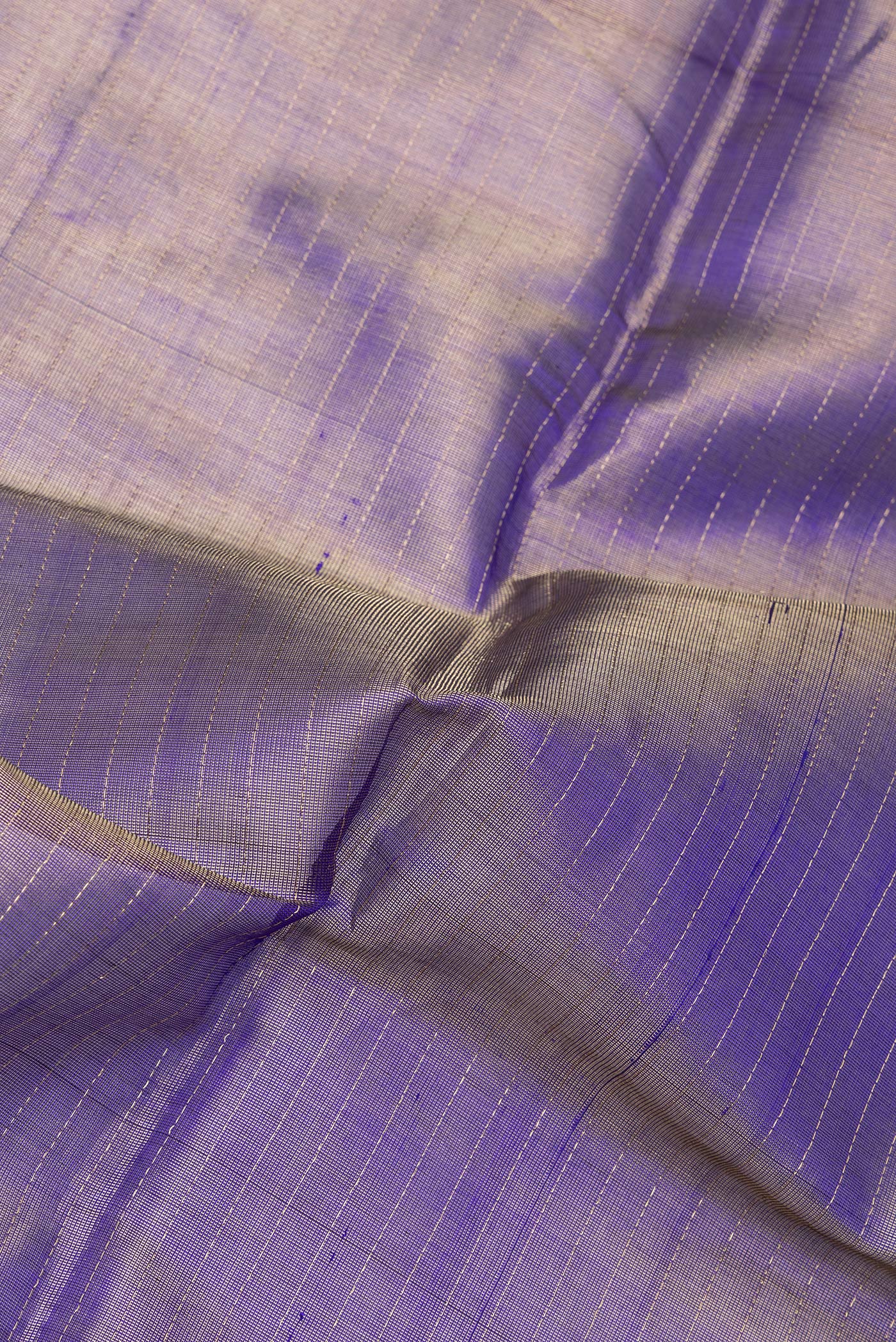 Close up of Purple Dual Tone Silk Cotton Saree with Stripes on the body and Zari Border.  displaying folds