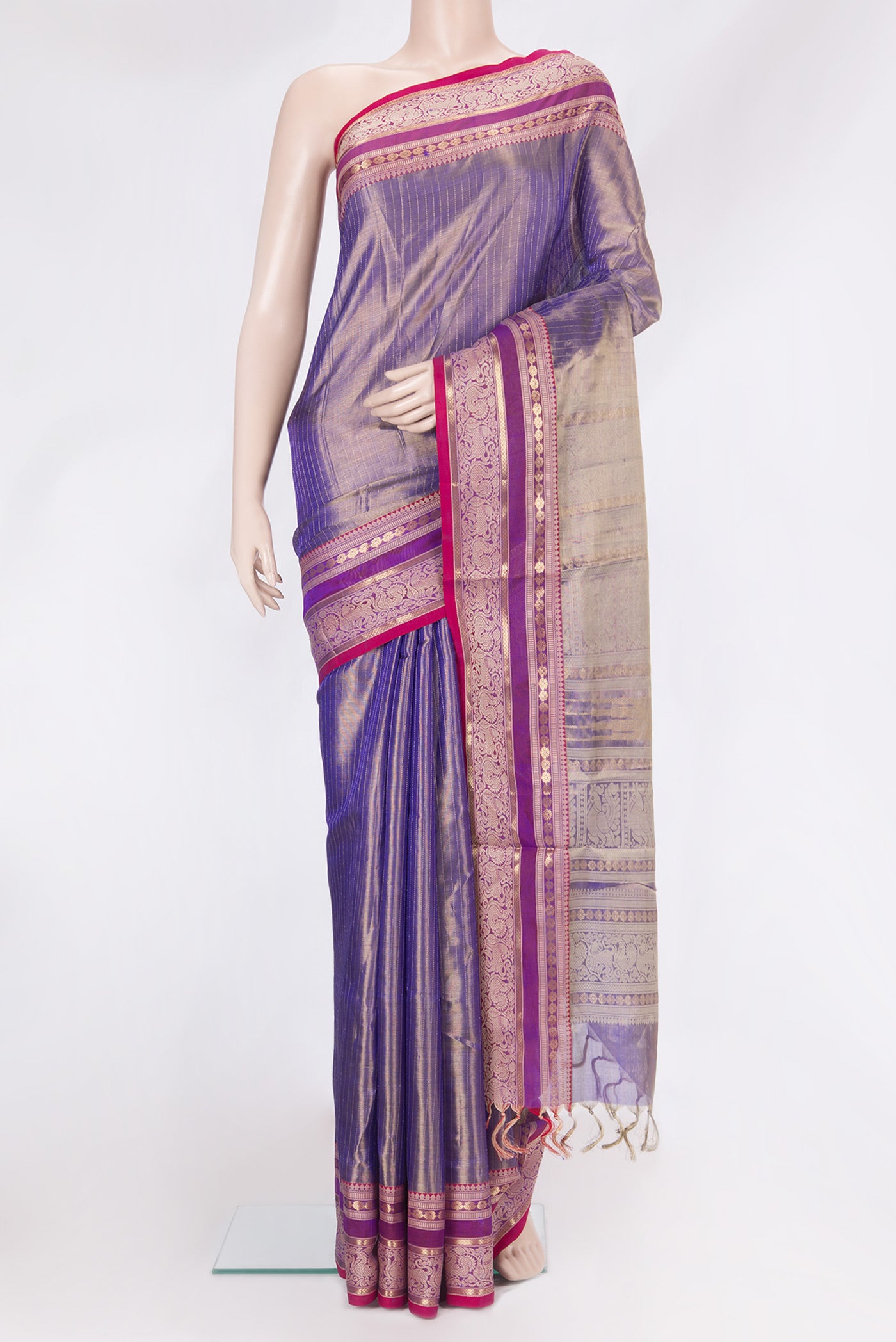 Purple Dual Tone Silk Cotton Saree with Stripes on the body and Zari Border.  displayed on a mannequin