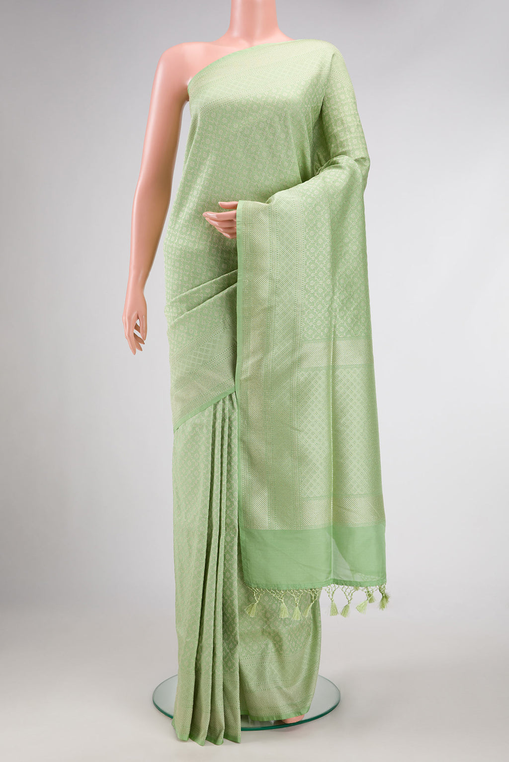 Pista Green Dual Tone Blended Banarasi Silk Saree with Zari Brocade on the body and Zari Border.  displayed on a mannequin