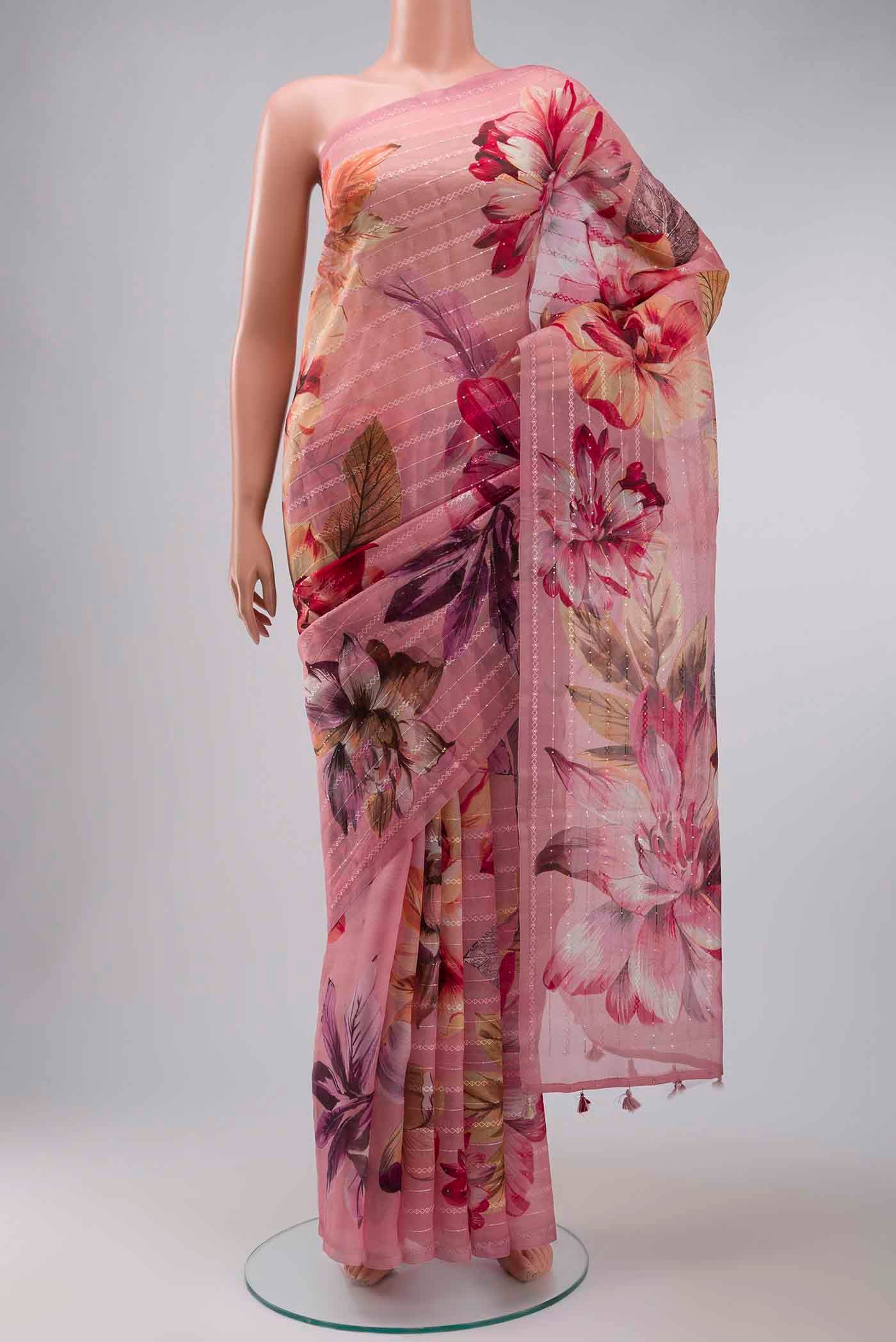 Pink Organza Silk Saree with Printed design on the body and Without Border displayed on a mannequin