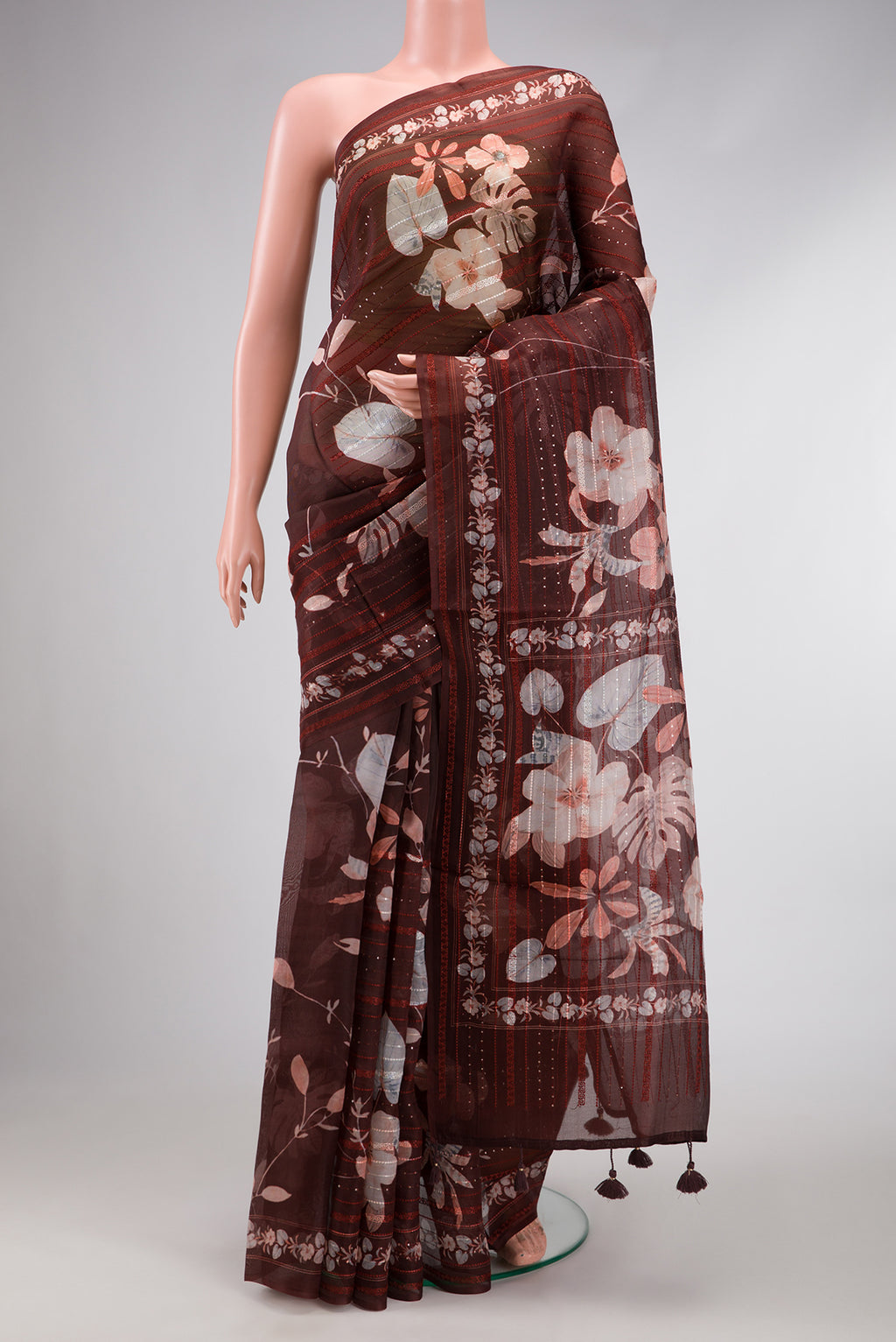Maroon Dual Tone Organza Silk Saree with Printed design on the body and Embroidery Border.  displayed on a mannequin