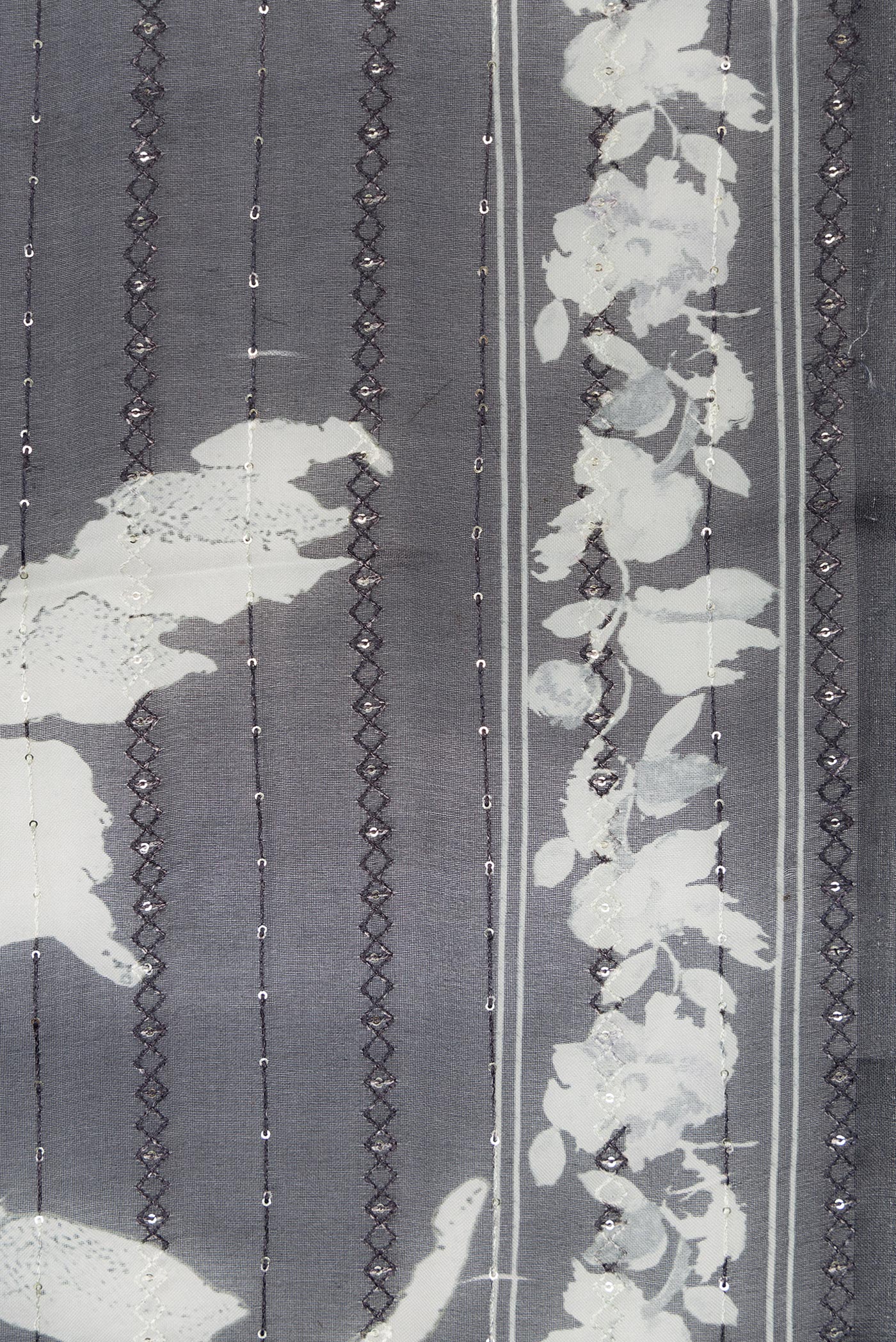 Border image of Black Dual Tone Organza Silk Saree with Printed design on the body and Printed Border. 