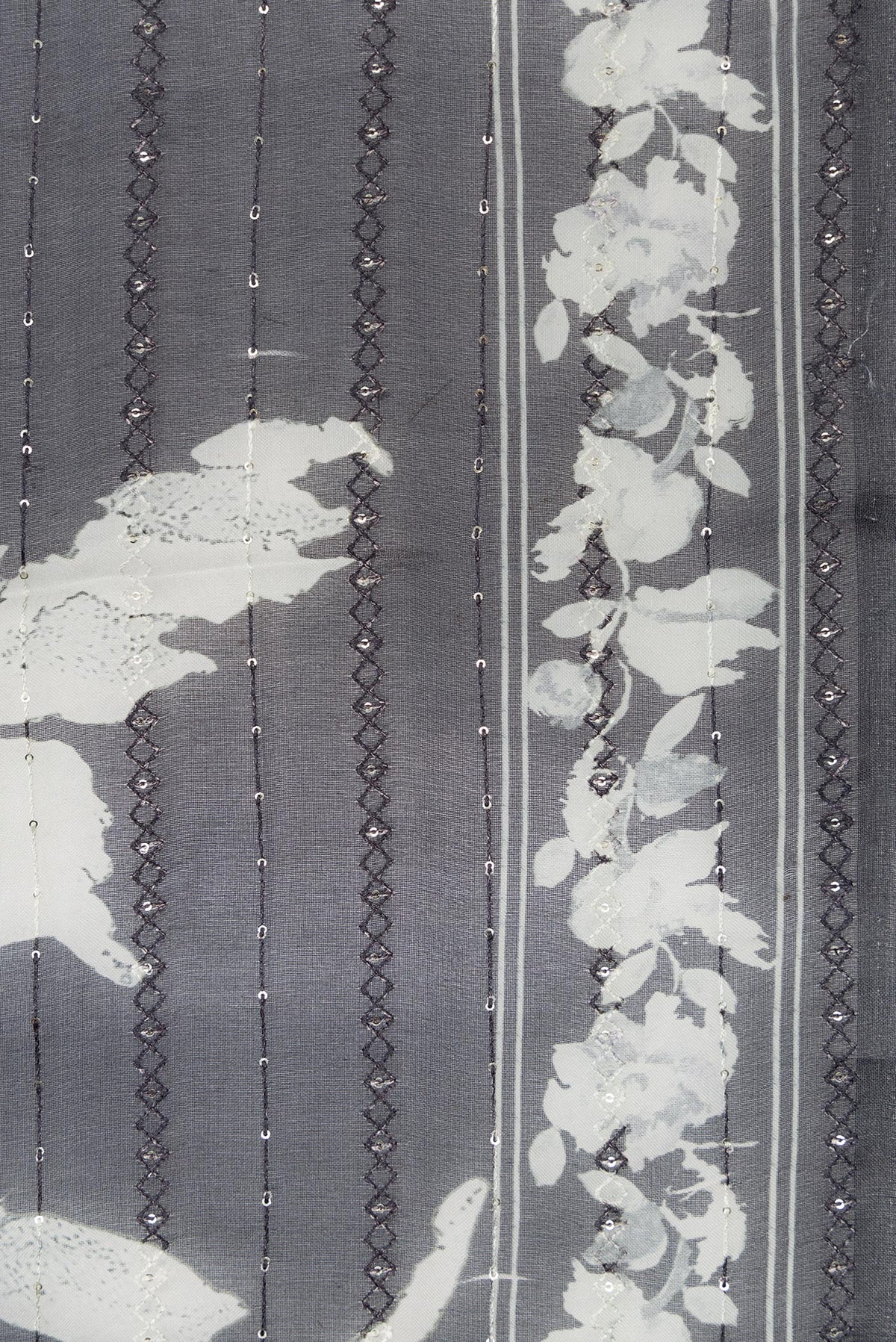 Border image of Black Dual Tone Organza Silk Saree with Printed design on the body and Printed Border. 