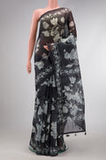 Black Dual Tone Organza Silk Saree with Printed design on the body and Printed Border.  displayed on a mannequin