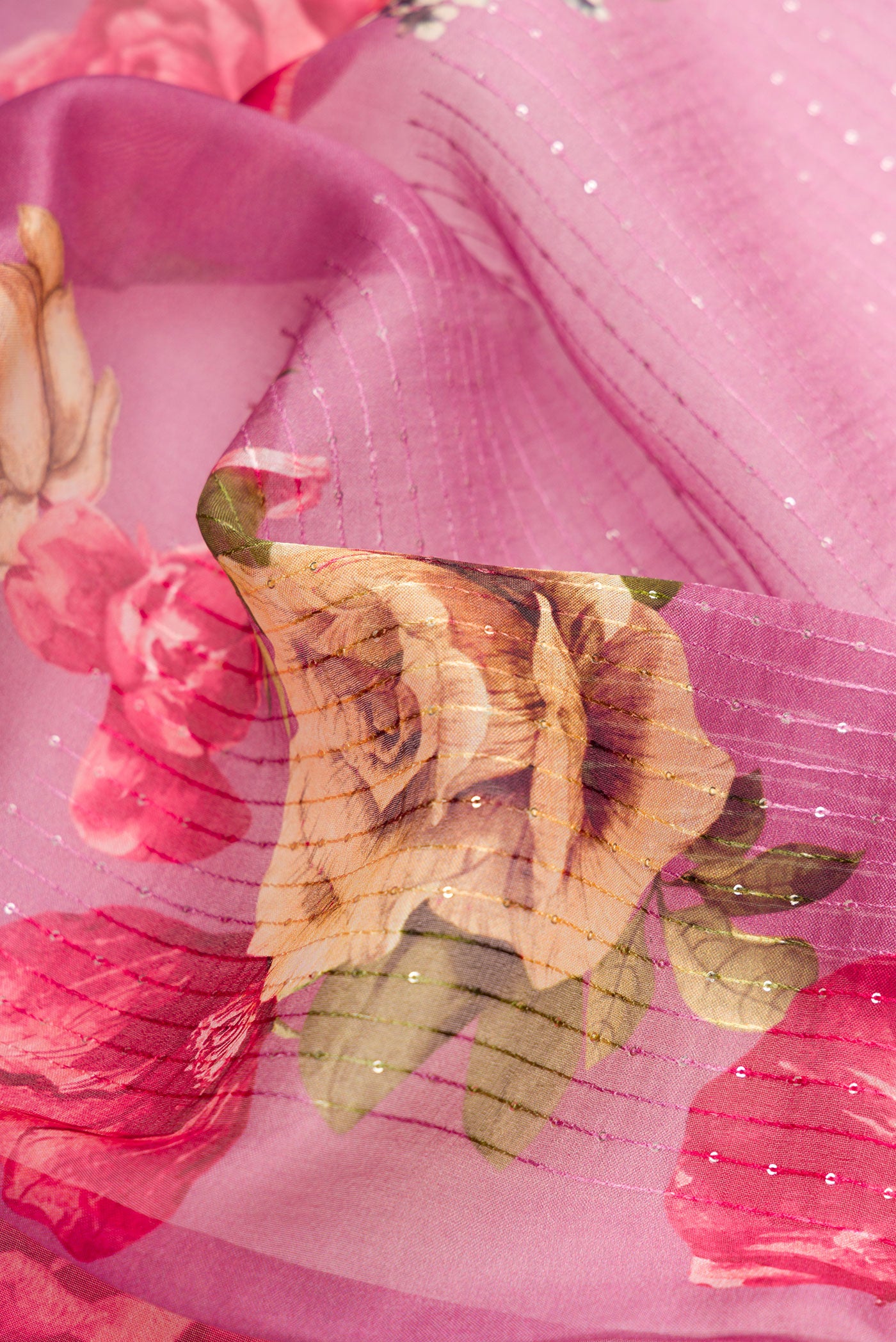 Close up of Burgundy Dual Tone Organza Silk Saree with Printed design on the body and Without Border.  displaying folds