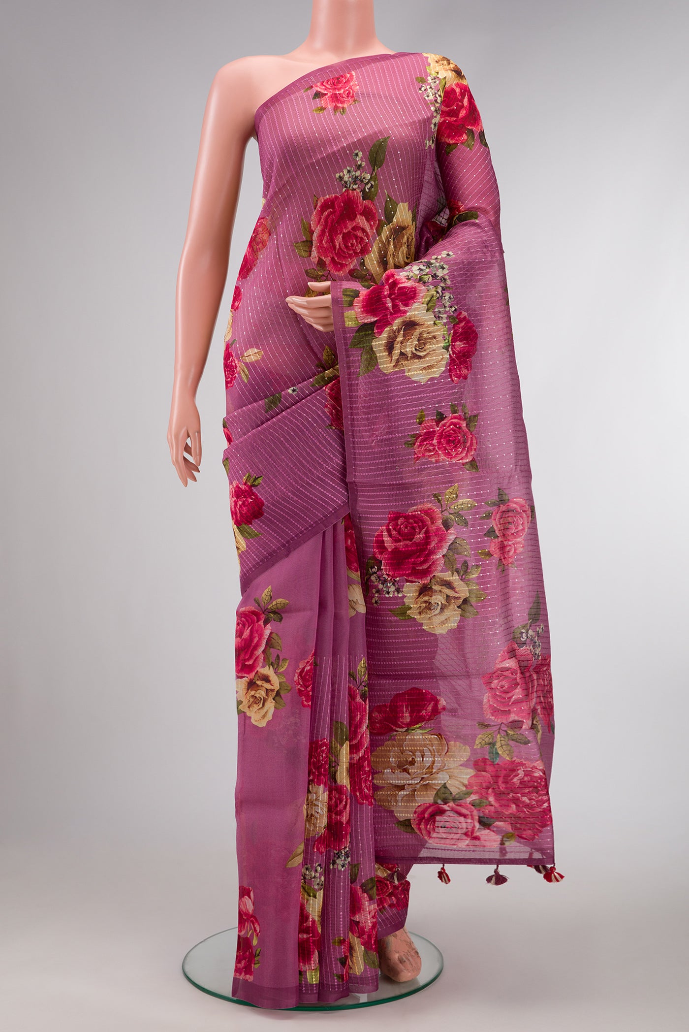Burgundy Dual Tone Organza Silk Saree with Printed design on the body and Without Border.  displayed on a mannequin