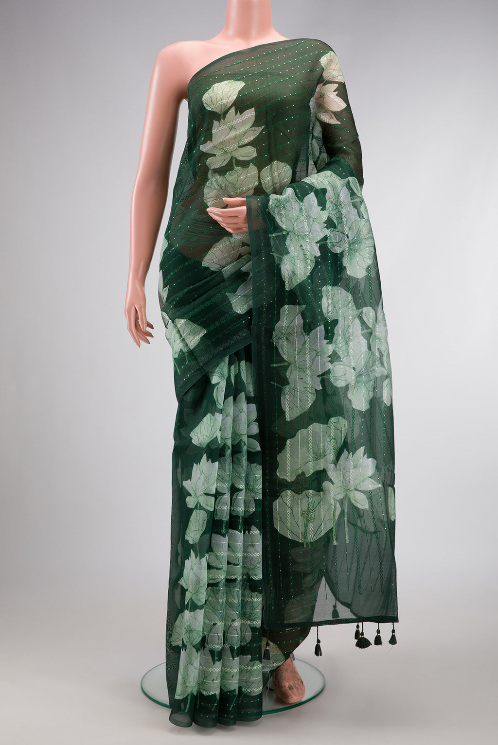 Bottle Green Dual Tone Organza Silk Saree with Embroidery on the body and Without Border.  displayed on a mannequin