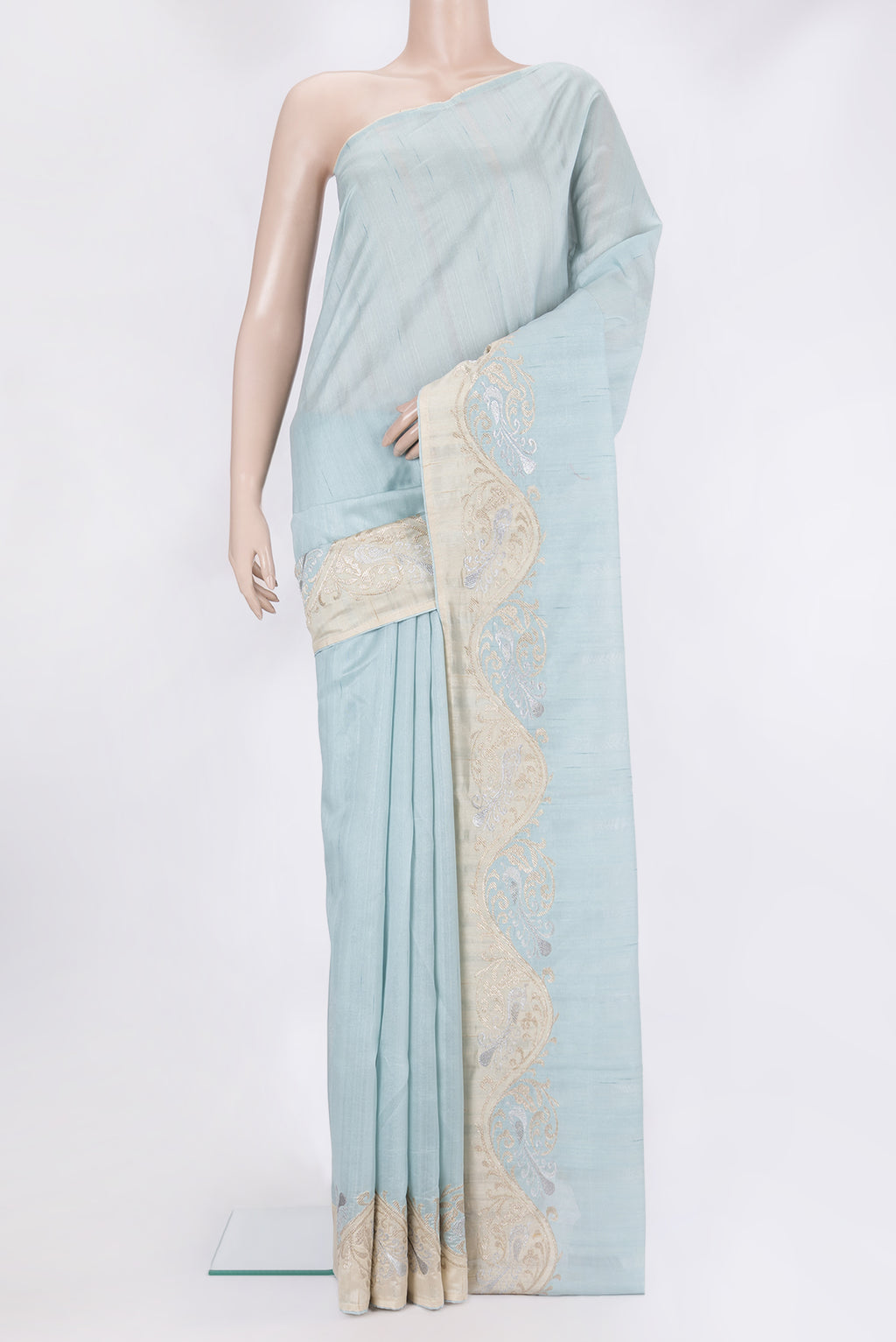 Sky Blue Blended Tussar Silk Saree with Plain Body and Fancy Border.  displayed on a mannequin