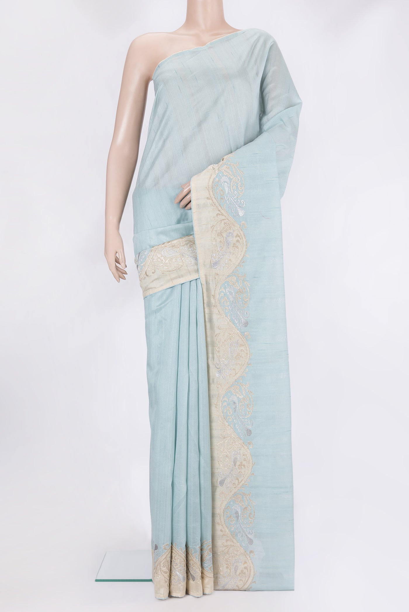 Sky Blue Blended Tussar Silk Saree with Plain Body and Fancy Border.  displayed on a mannequin
