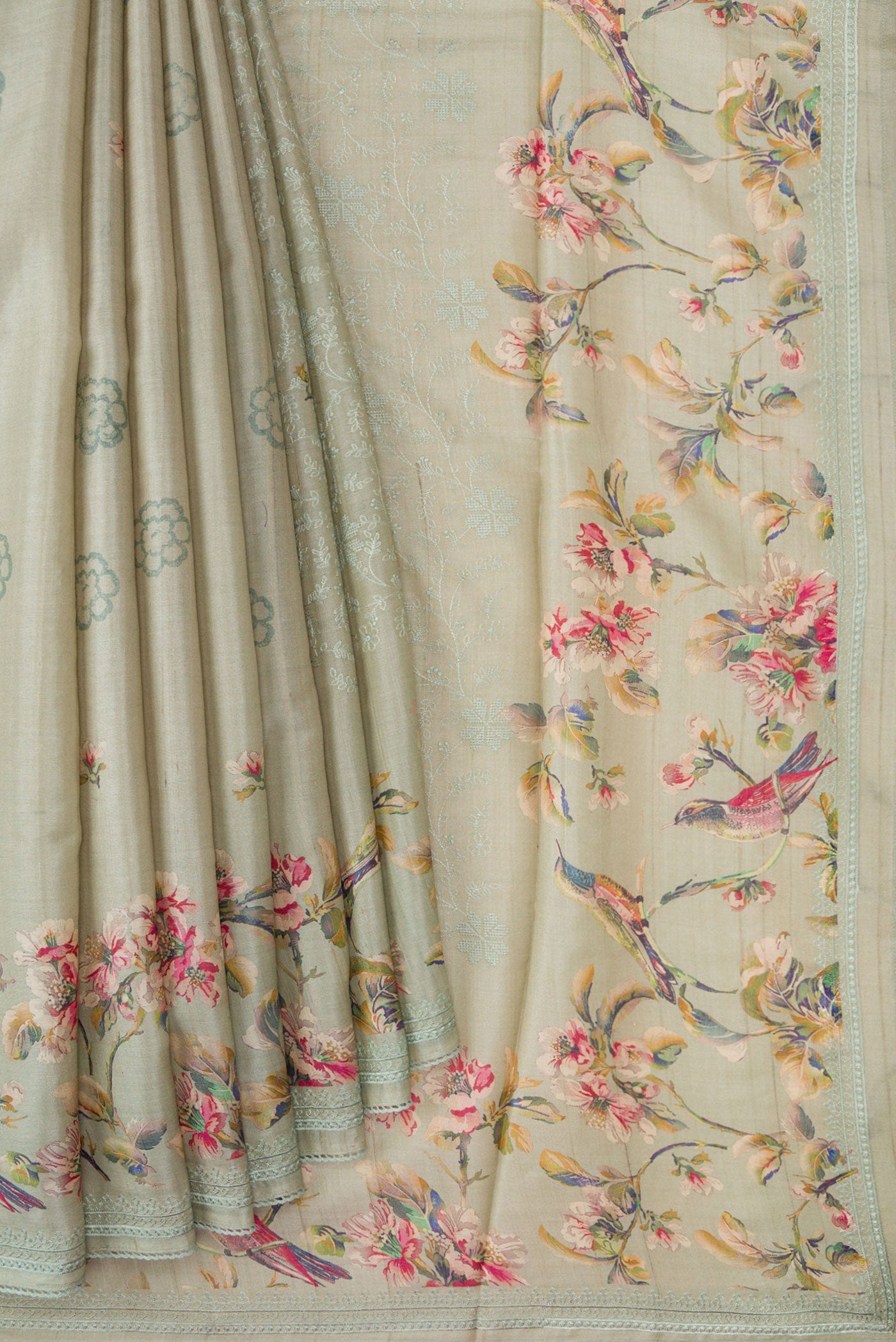 Pleats and pallu of Grey Dual Tone Tussar Silk Saree with Printed design on the body and Embroidery Border. 