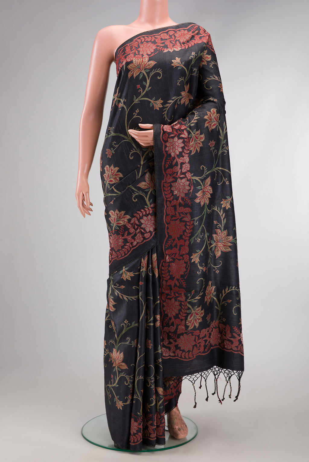 Black Dual Tone Tussar Silk Saree with Printed design on the body and Embroidery Border.  displayed on a mannequin