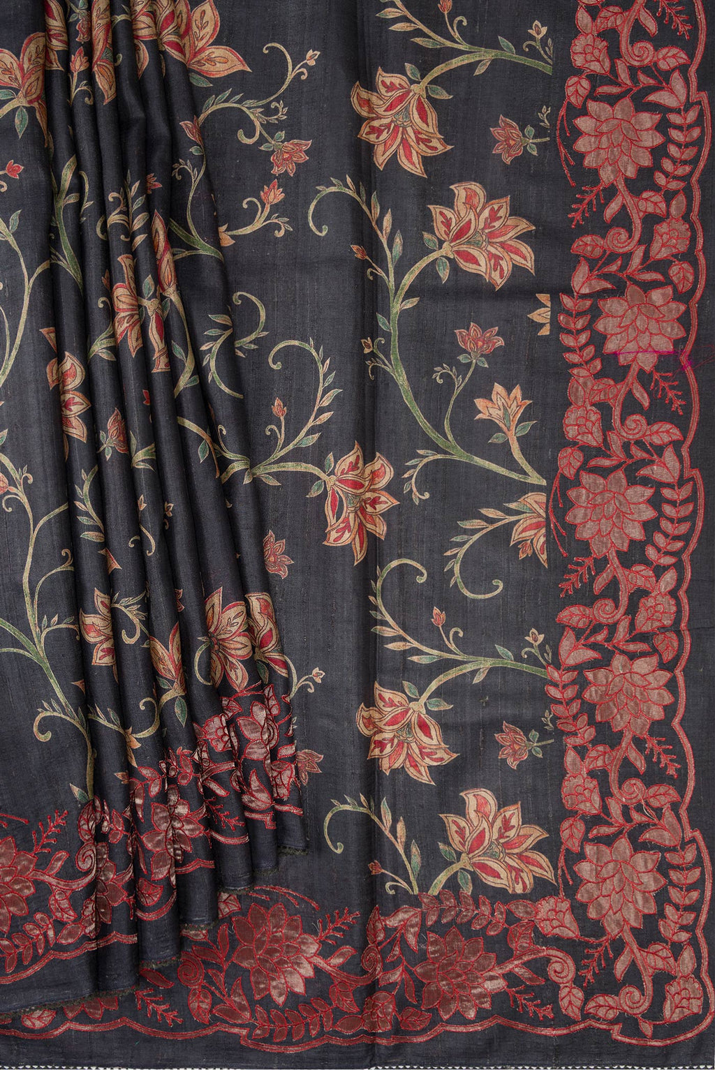 Pleats and pallu of Black Dual Tone Tussar Silk Saree with Printed design on the body and Embroidery Border. 