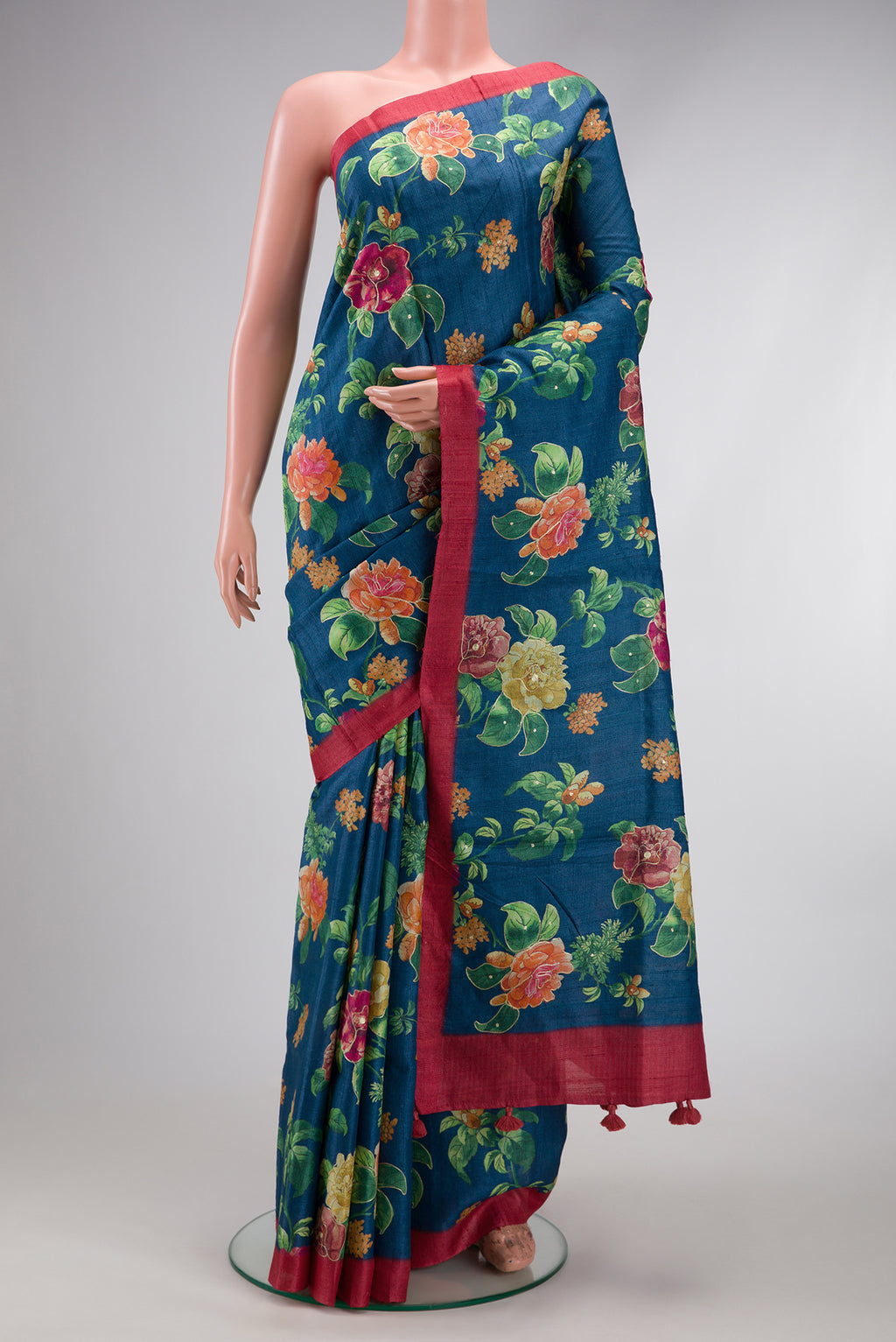 Navy Blue Dual Tone Tussar Silk Saree with Printed design on the body and Plain Border.  displayed on a mannequin