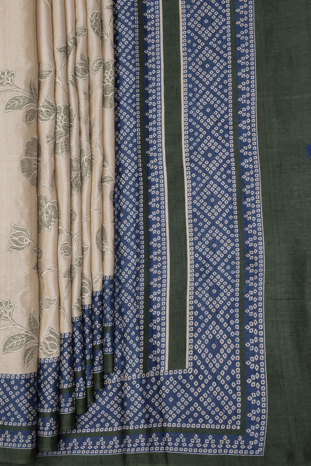 Pleats and pallu of Beige Dual Tone Tussar Silk Saree with Embroidery on the body and Printed Border. 