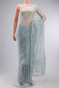 Light Blue Organza Silk Saree with Printed design on the body and Printed Border displayed on a mannequin