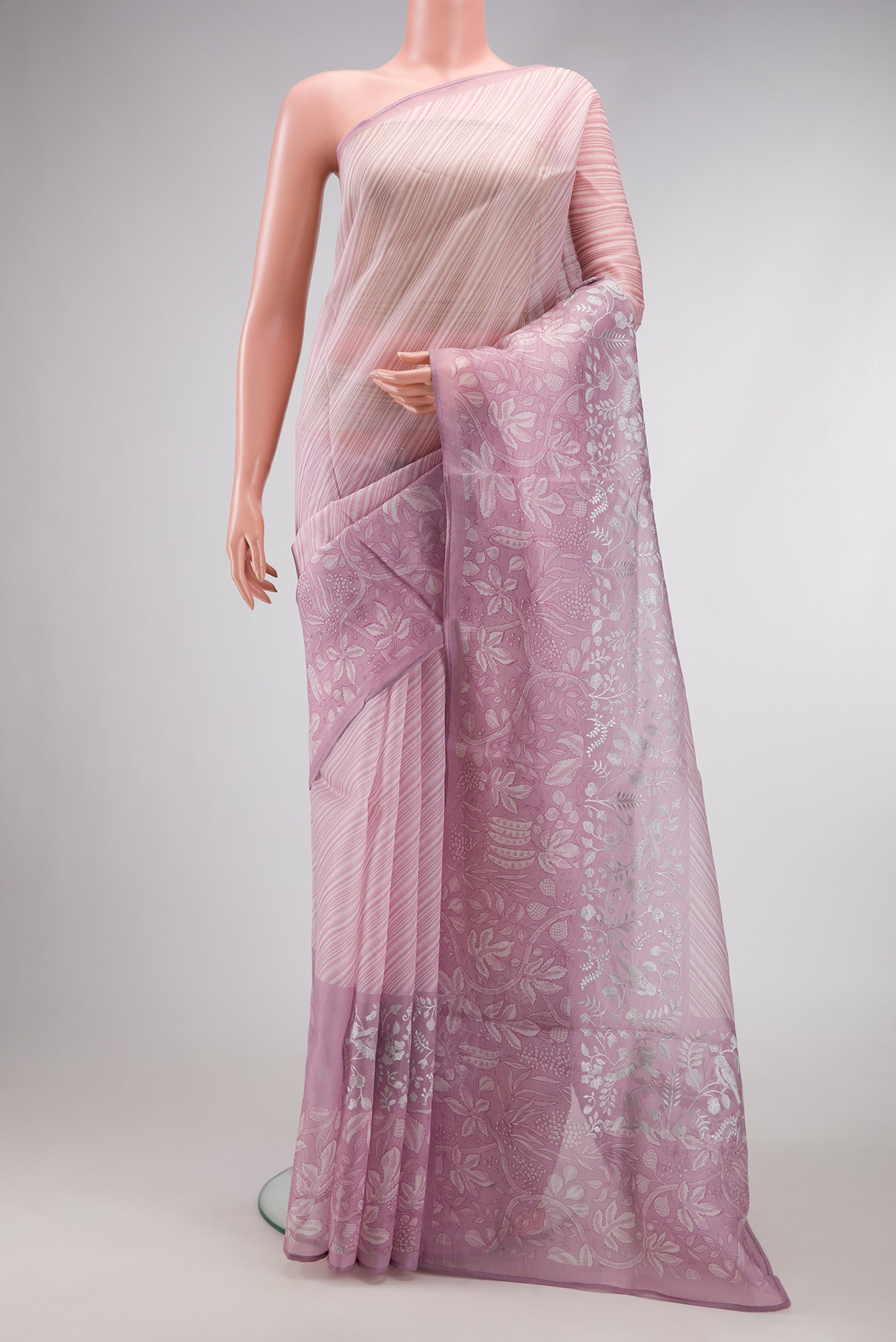 Lavender Dual Tone Organza Silk Saree with Printed design on the body and Embroidery Border.  displayed on a mannequin