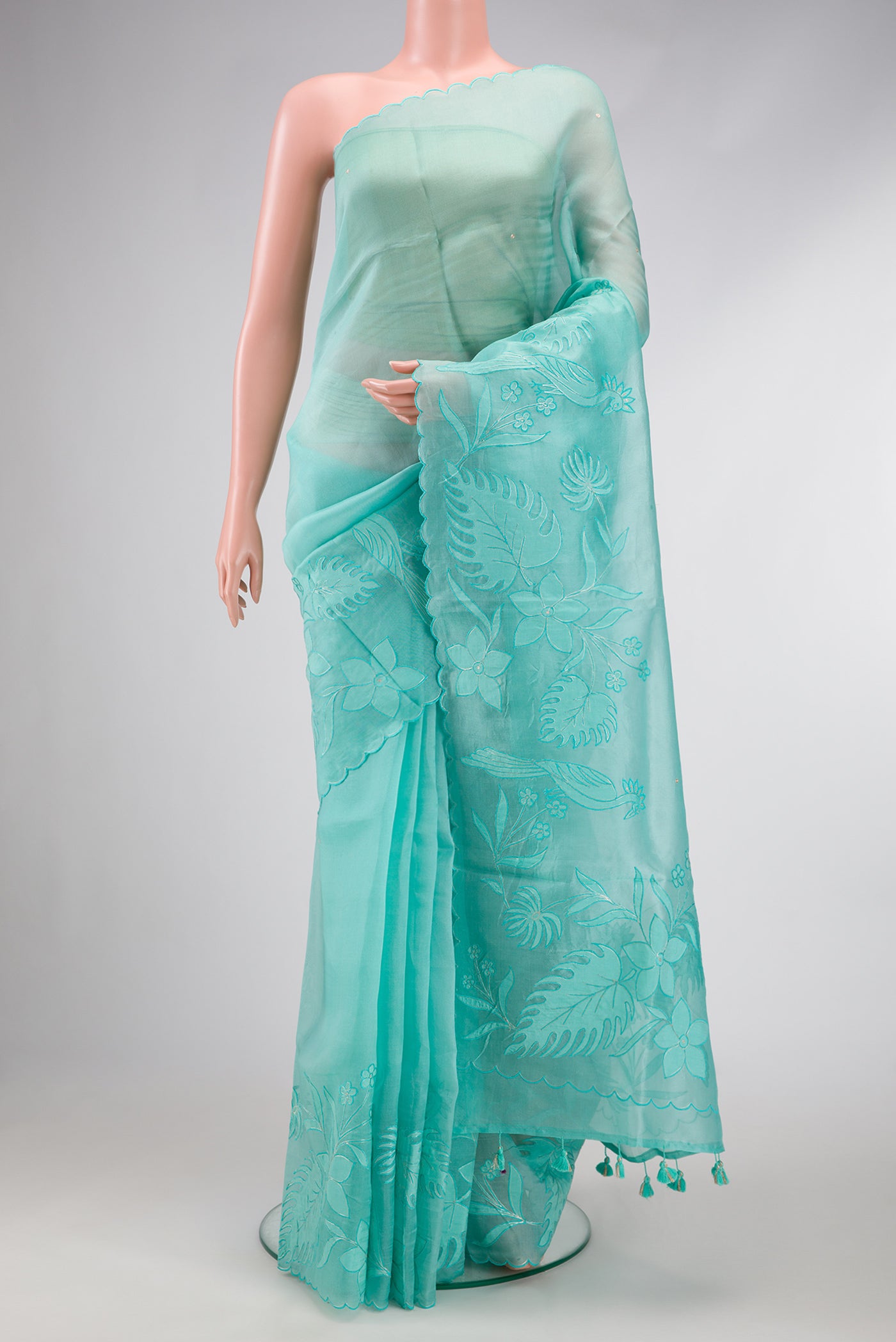 Sky Blue Dual Tone Organza Silk Saree with Embroidery on the body and Embroidery Border.  displayed on a mannequin