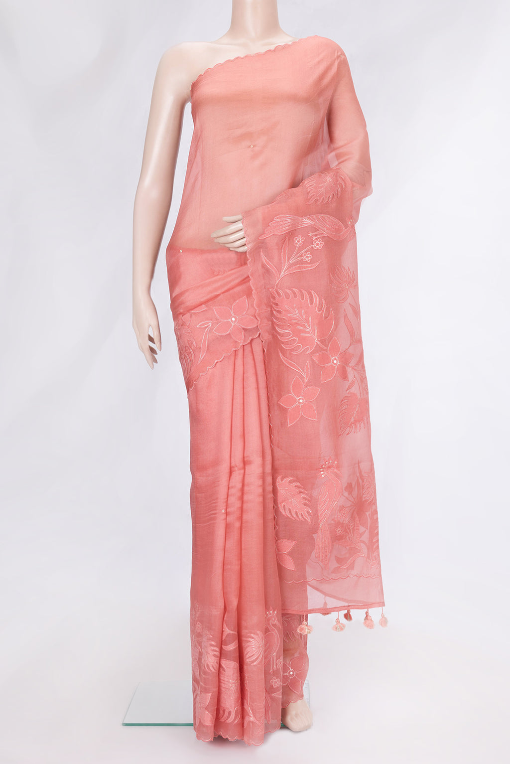 Peach Dual Tone Organza Silk Saree with Embroidery on the body and Embroidery Border.  displayed on a mannequin