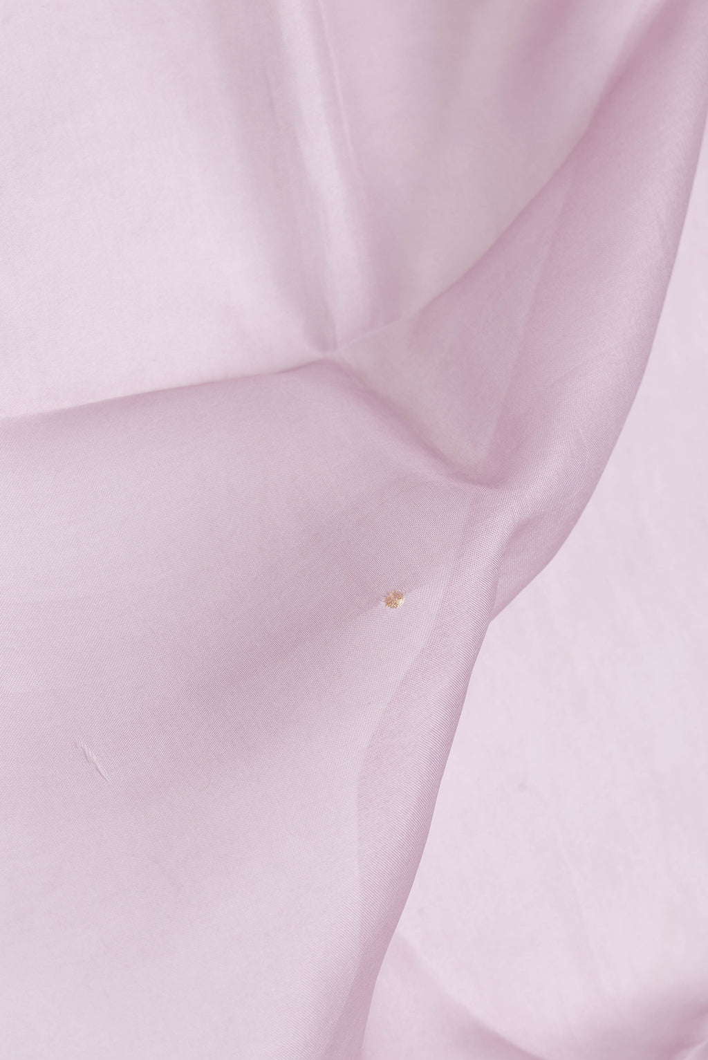 Close up of Lavender Dual Tone Organza Silk Saree with Embroidery on the body and Embroidery Border.  displaying folds