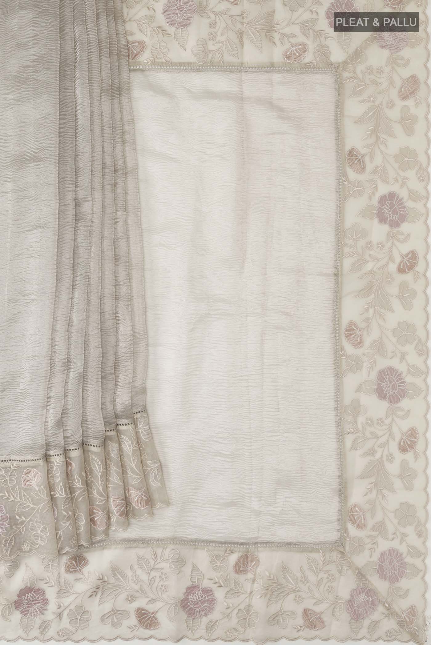 Pleats and pallu of Silver Tissue Silk Saree with Plain Body and Embroidery Border