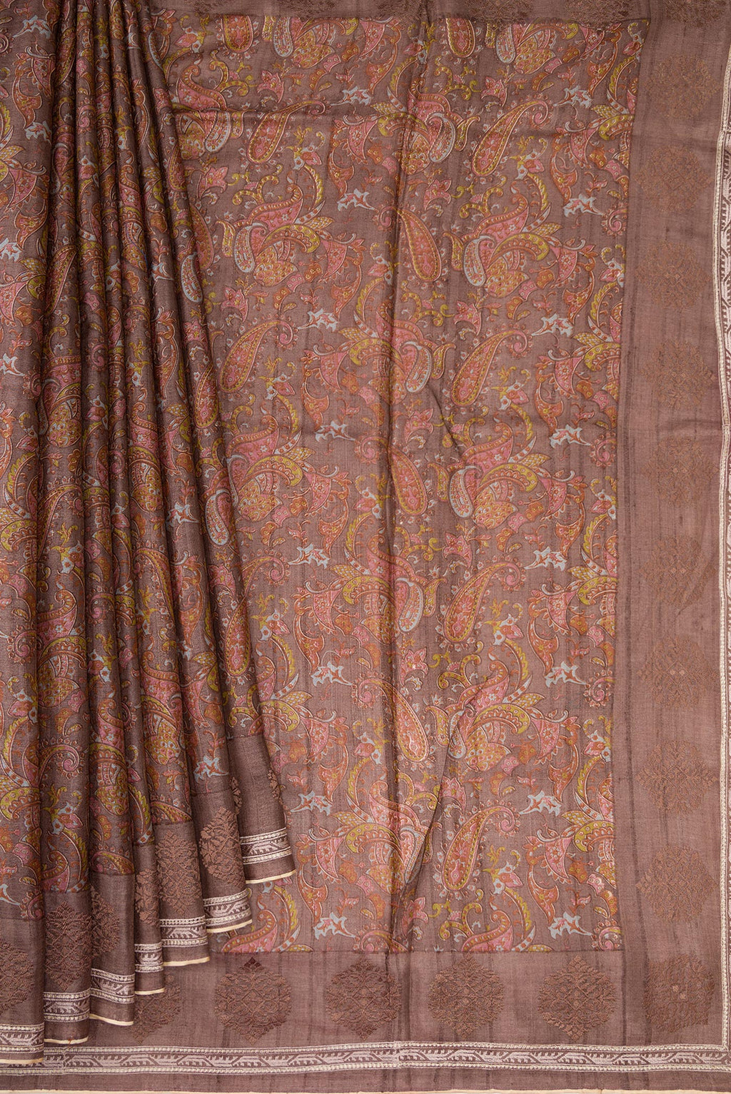 Pleats and pallu of Brown Dual Tone Tussar Silk Saree with Printed design on the body and Embroidery Border. 
